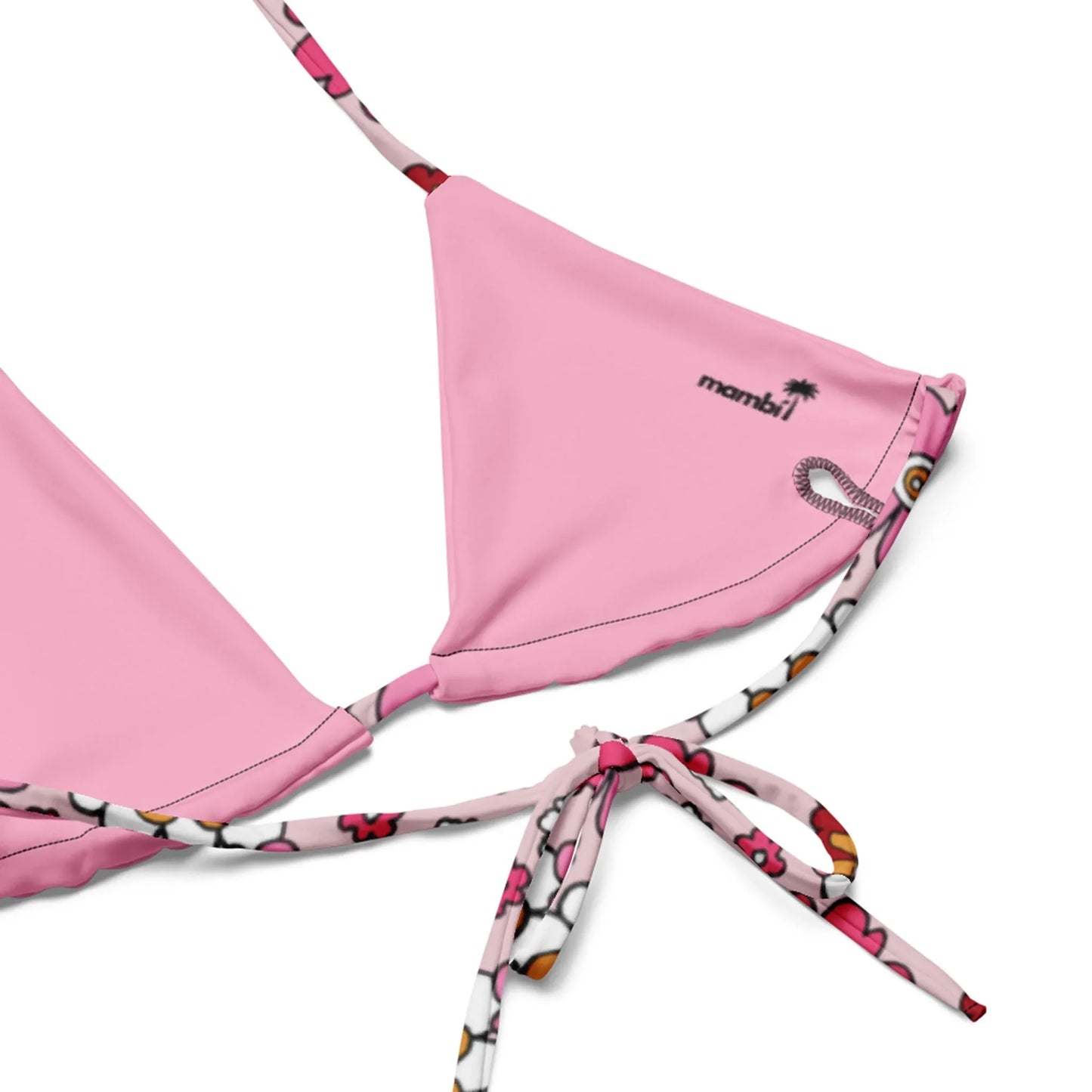 Close-up of Printful’s Adriana String Bikini Swimsuit top in pink with a patterned bottom tie. Made from recycled polyester, it features a small Mumbai palm tree logo and UPF 50+ protection.