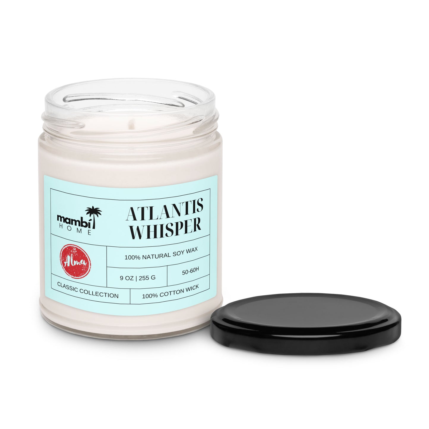 A glass jar candle labeled ATLANTIS WHISPER with a black lid beside it. The label mentions 100% natural soy wax, 9 oz, Classic Collection, and 100% cotton wick—perfect for those who love long-lasting candles. The candle is unlit.