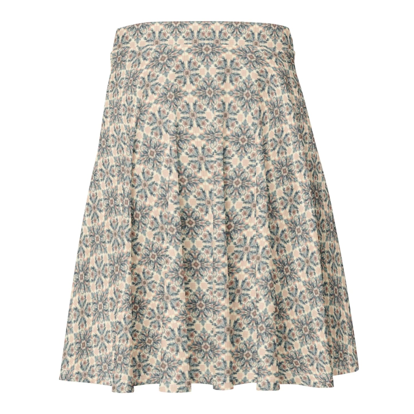 A knee-length A-line skirt featuring an intricate blue and grey floral geometric pattern on a beige background. The Mambí skirt has a fitted waistband and flows outward toward the hem.