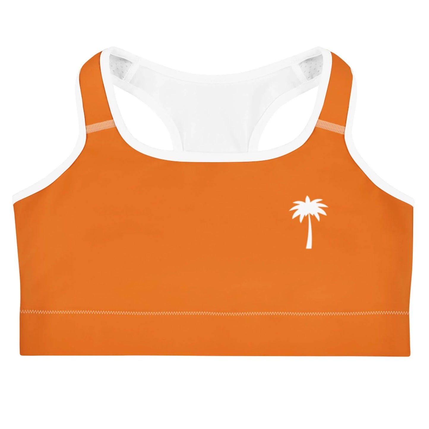 An orange Mambí sports bra with white straps and trim, featuring a small white palm tree graphic on the left side of the chest.
