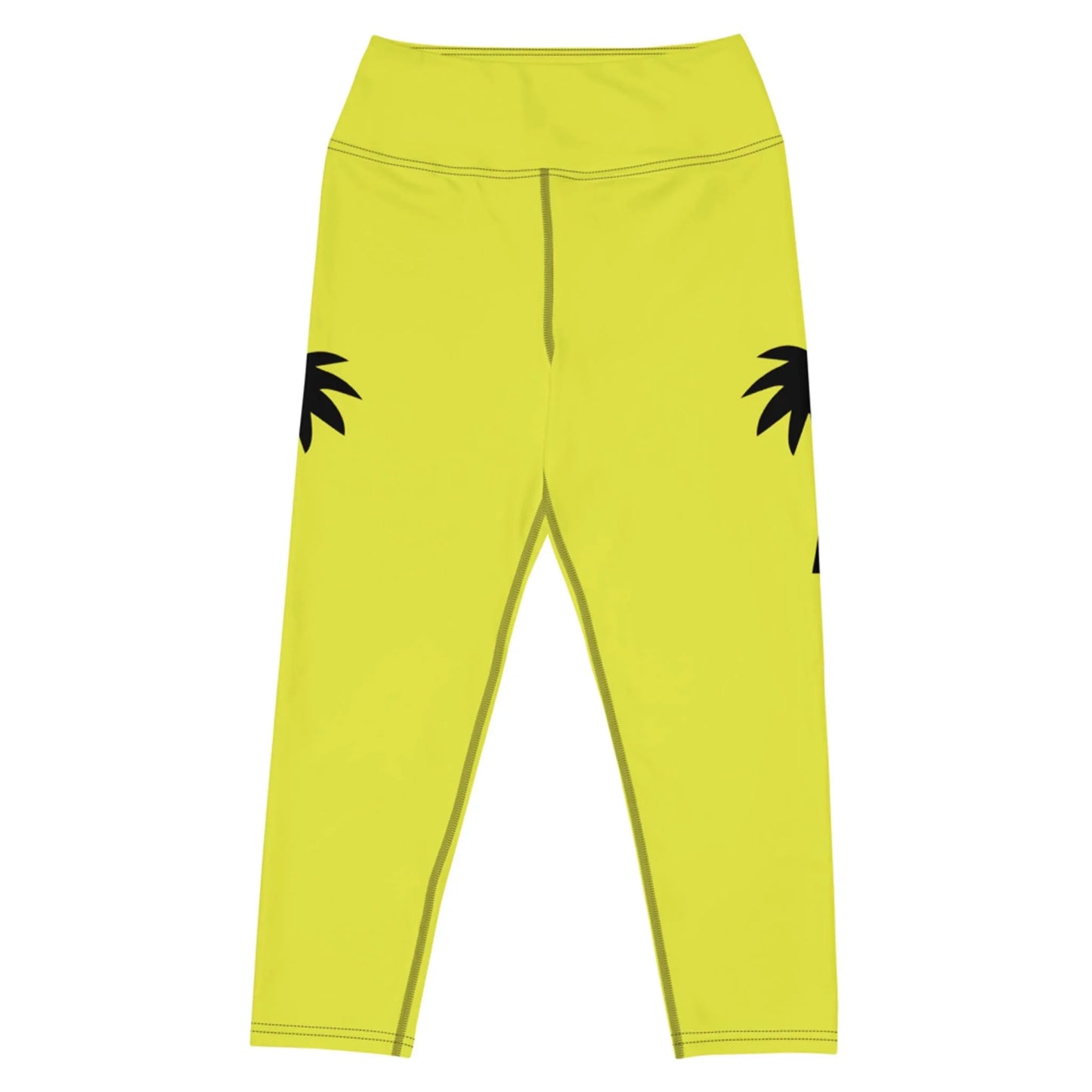 Part of the Printful activewear line, the Aventura High-Rise Yoga Capri Leggings for women feature yellow hues, four-way stretch fabric, and bold black palm leaf graphics on a white base along the outer thighs.