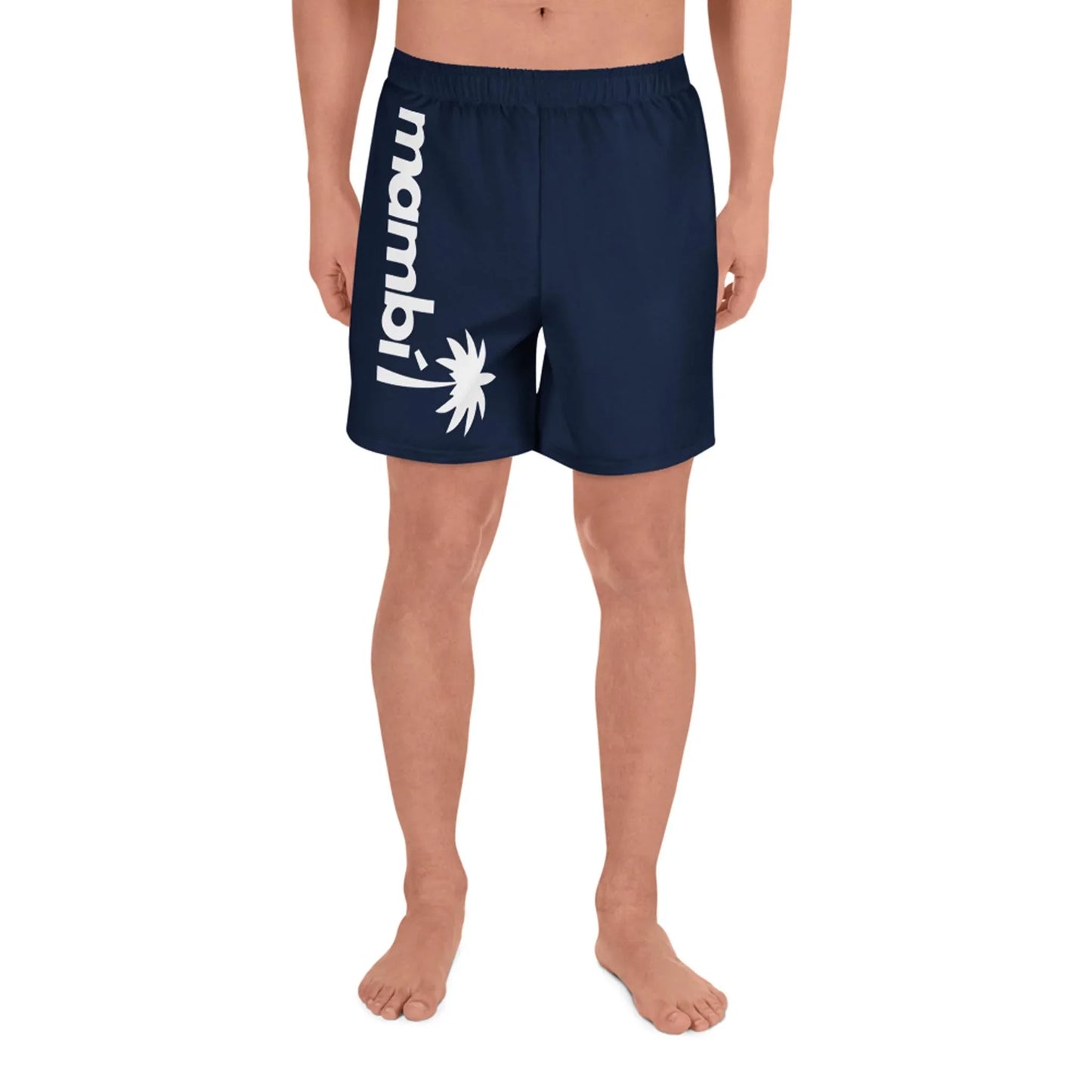 A person stands barefoot wearing navy blue Belmar Long Athletic Shorts by Printful, featuring mambil and a white palm tree graphic on the left leg. Designed for unisex comfort and performance, the background is plain white.