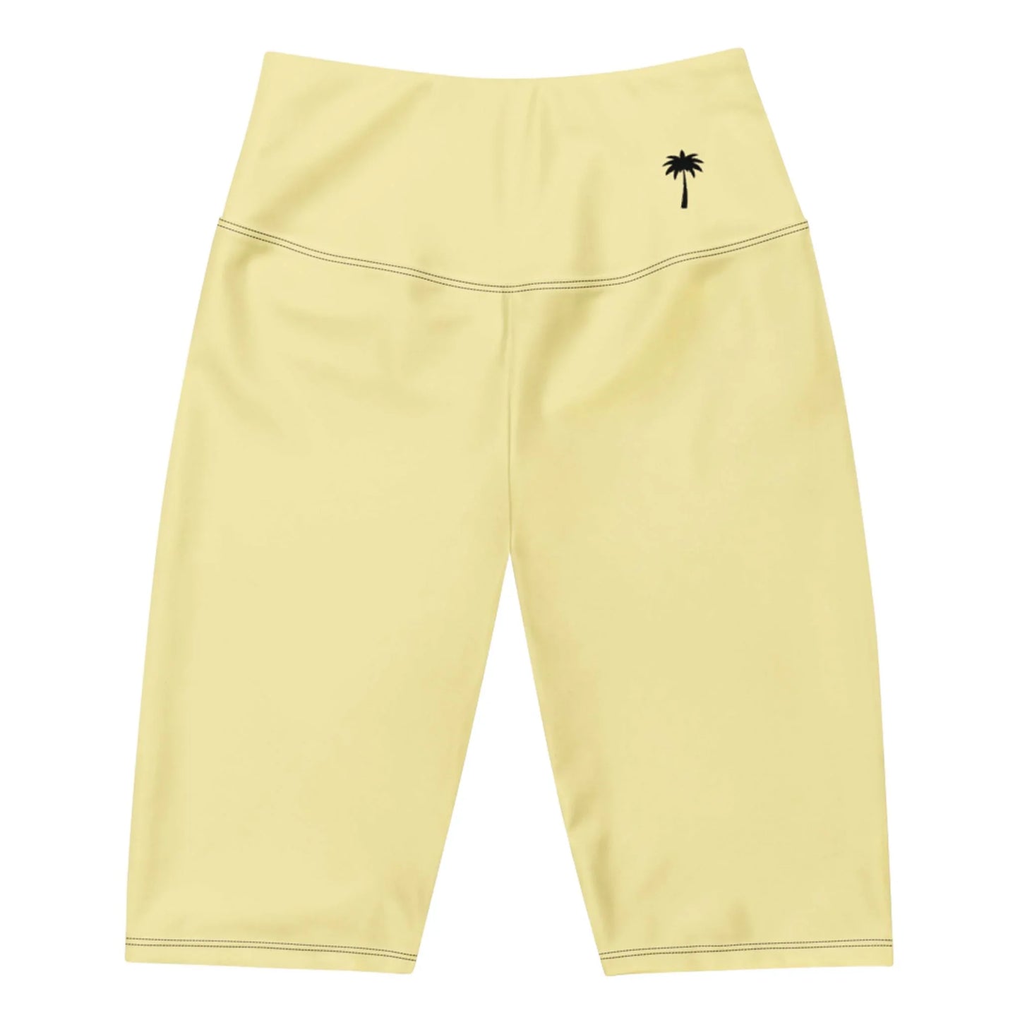 Light yellow Mambí high-waisted biker shorts featuring a small black palm tree graphic on the left hip area, displayed on a white background.