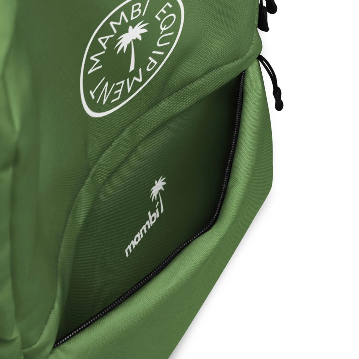 Close-up of the Boulevard East All-Purpose Backpack by Printful, featuring a partially open front pocket with a white mambi logo and palm tree graphic. The top showcases a circular Mambi Equipment logo; includes a hidden back pocket for security.