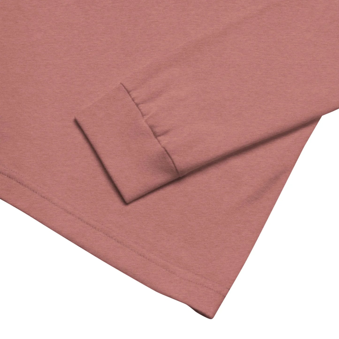Close-up of a Mambí long sleeve hem and cuff on a mauve or dusty pink shirt, highlighting the fabric texture and stitching detail. The shirt is laid flat against a white background.