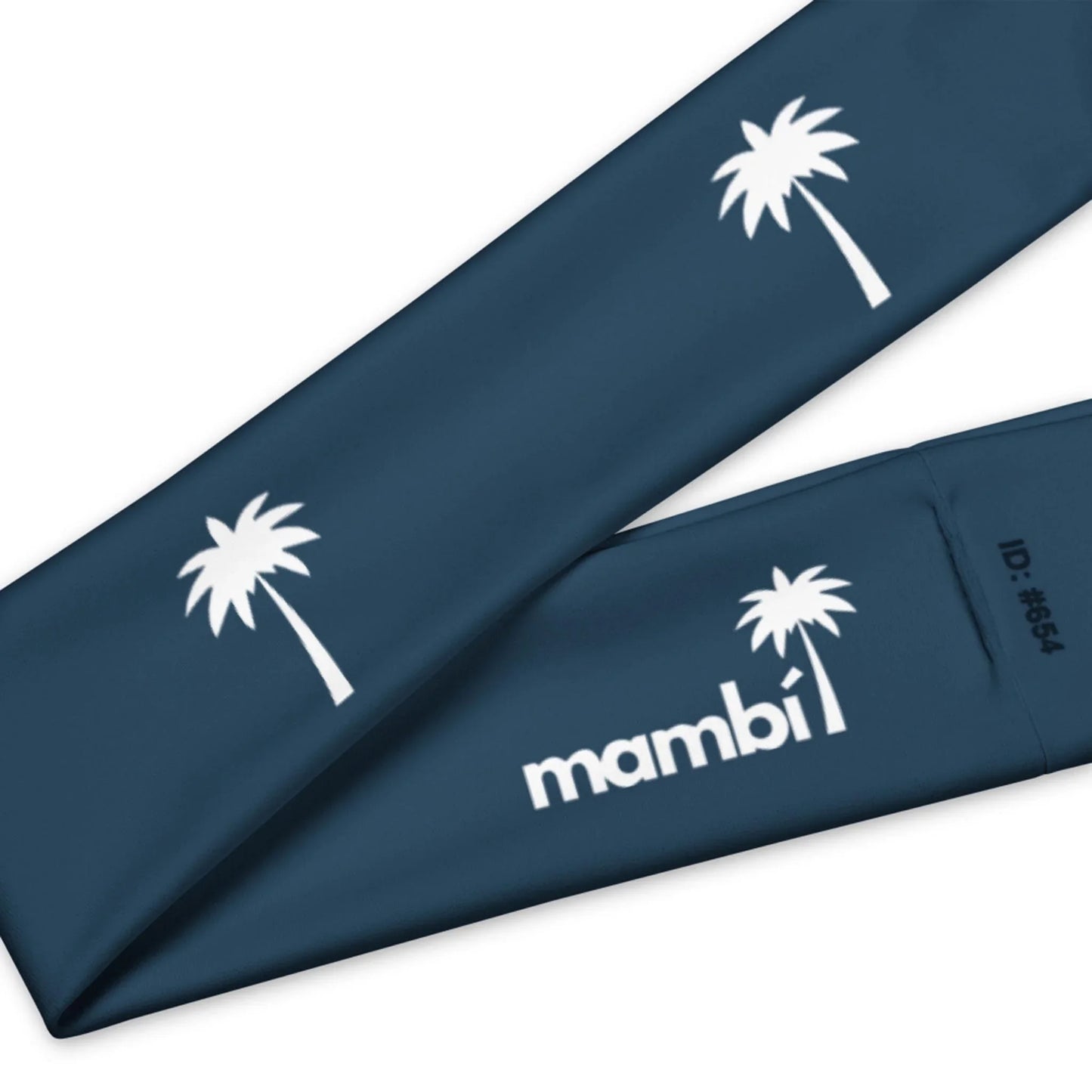 A navy blue fabric featuring white palm tree graphics and the word Mambí, along with the text ID: #654.