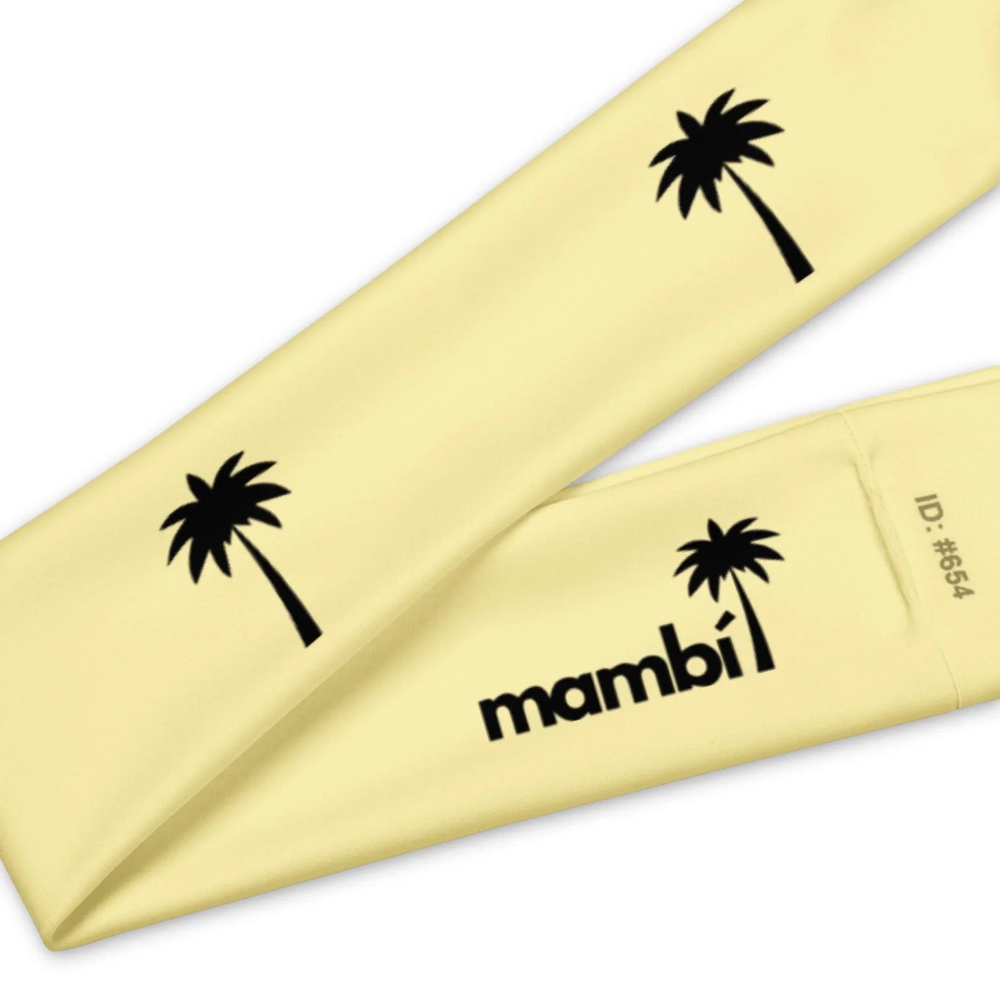 A close-up of two overlapping yellow fabric bands featuring black palm tree graphics. One band displays the word Mambí and ID: #654 in bold black text.