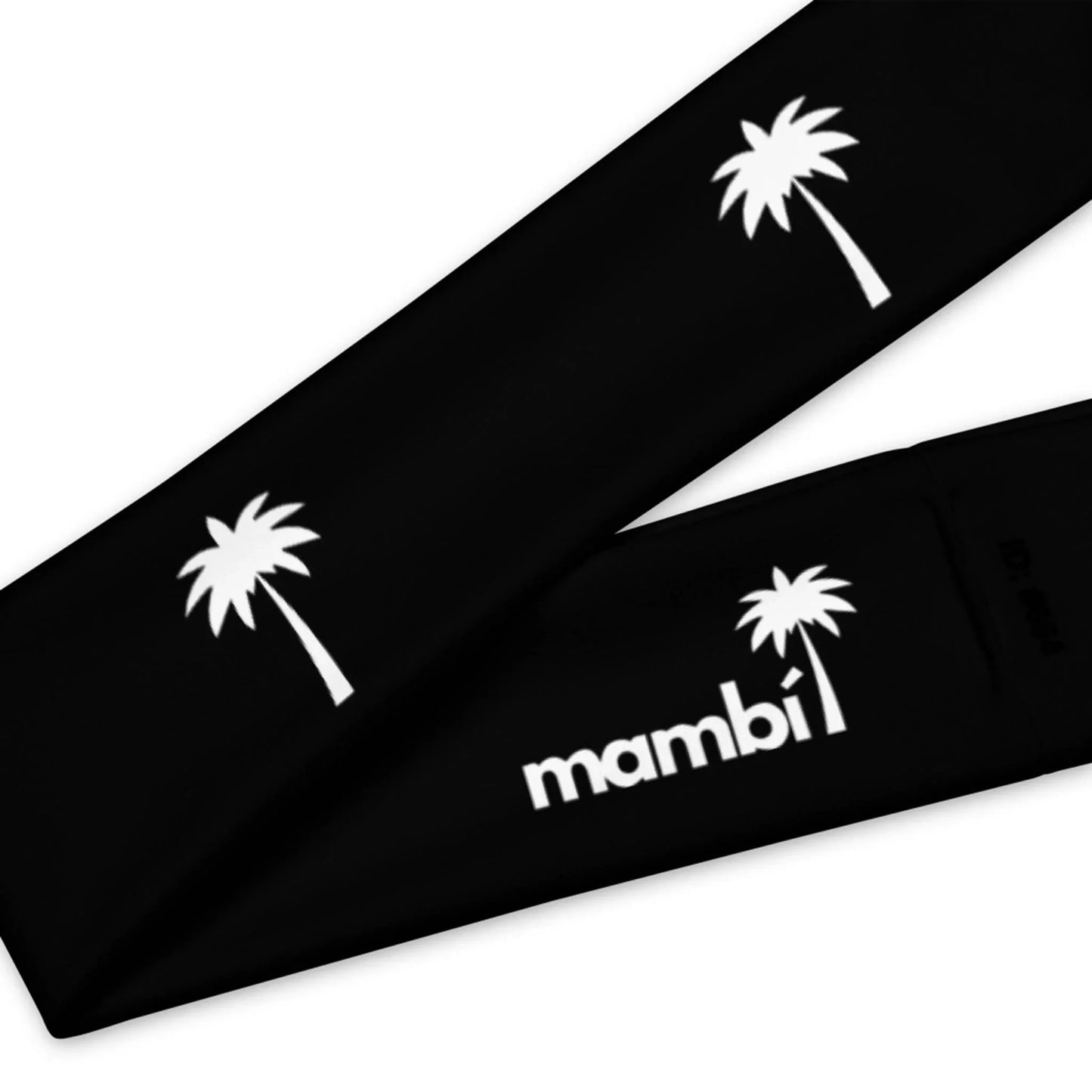 A close-up of two black fabric sleeves featuring white palm tree graphics and the word Mambí in bold white letters.