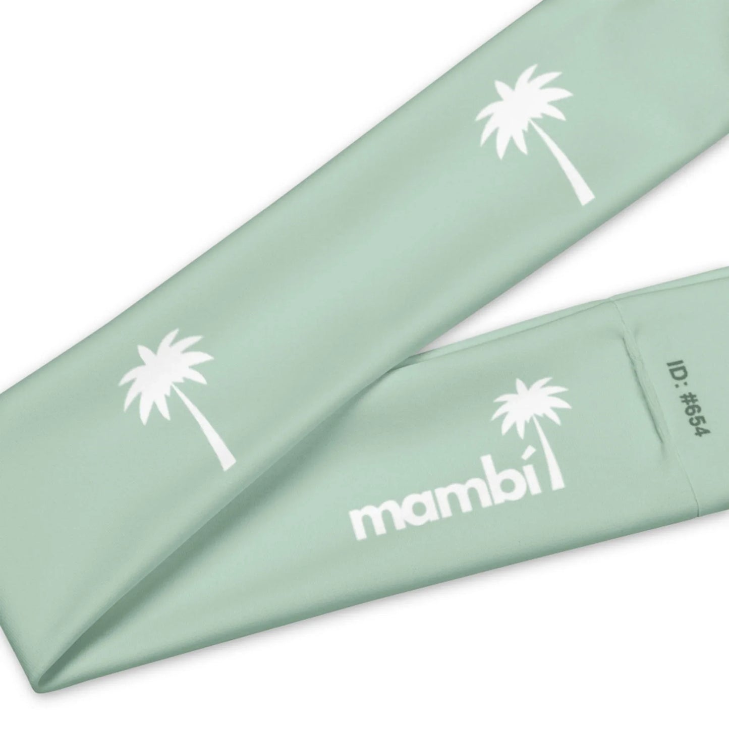 A mint green fabric band featuring white palm tree graphics, Mambí in bold white letters, and ID number #654.