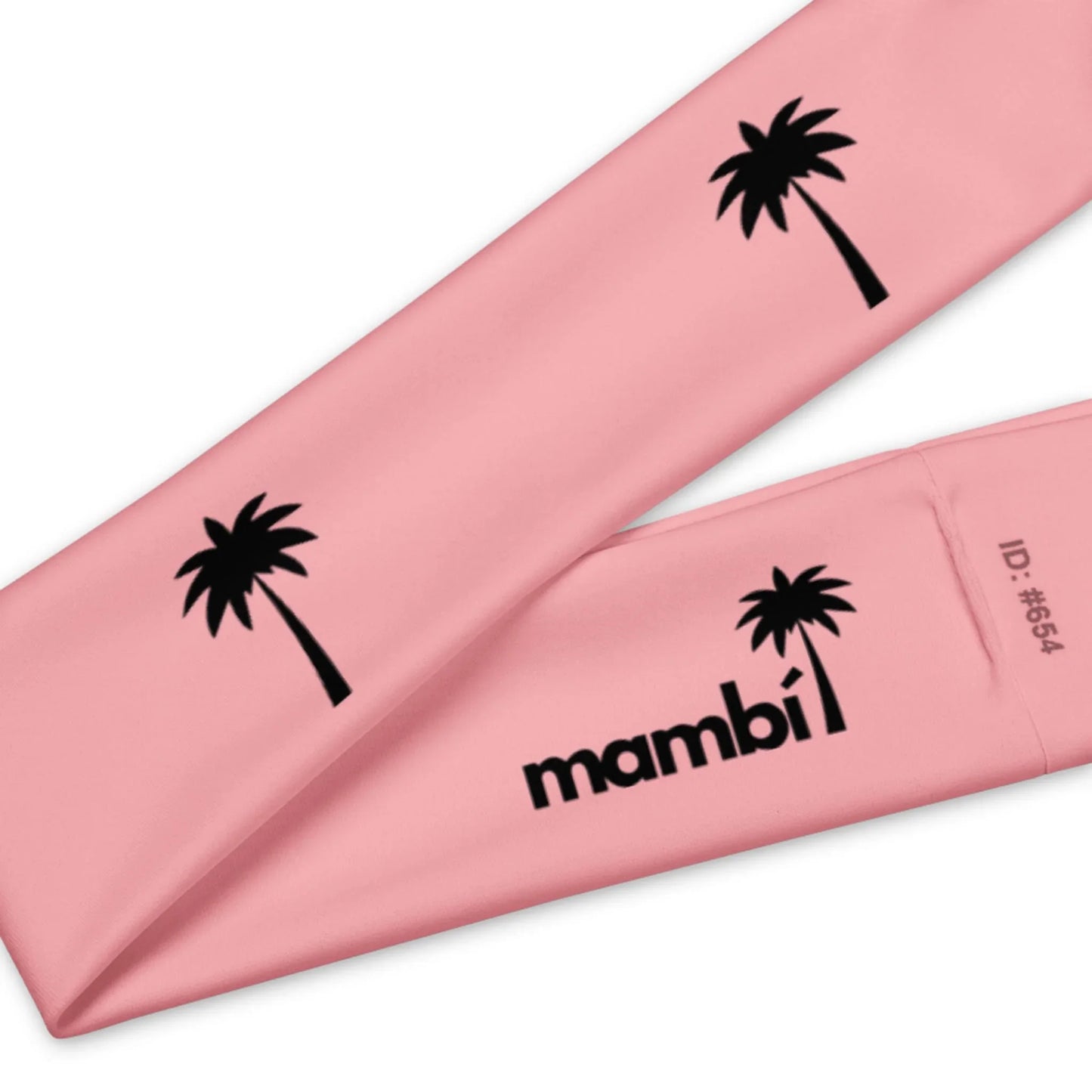 A pink fabric item featuring black palm tree graphics and the word Mambí in bold letters, with ID: #654 on the lower right corner.