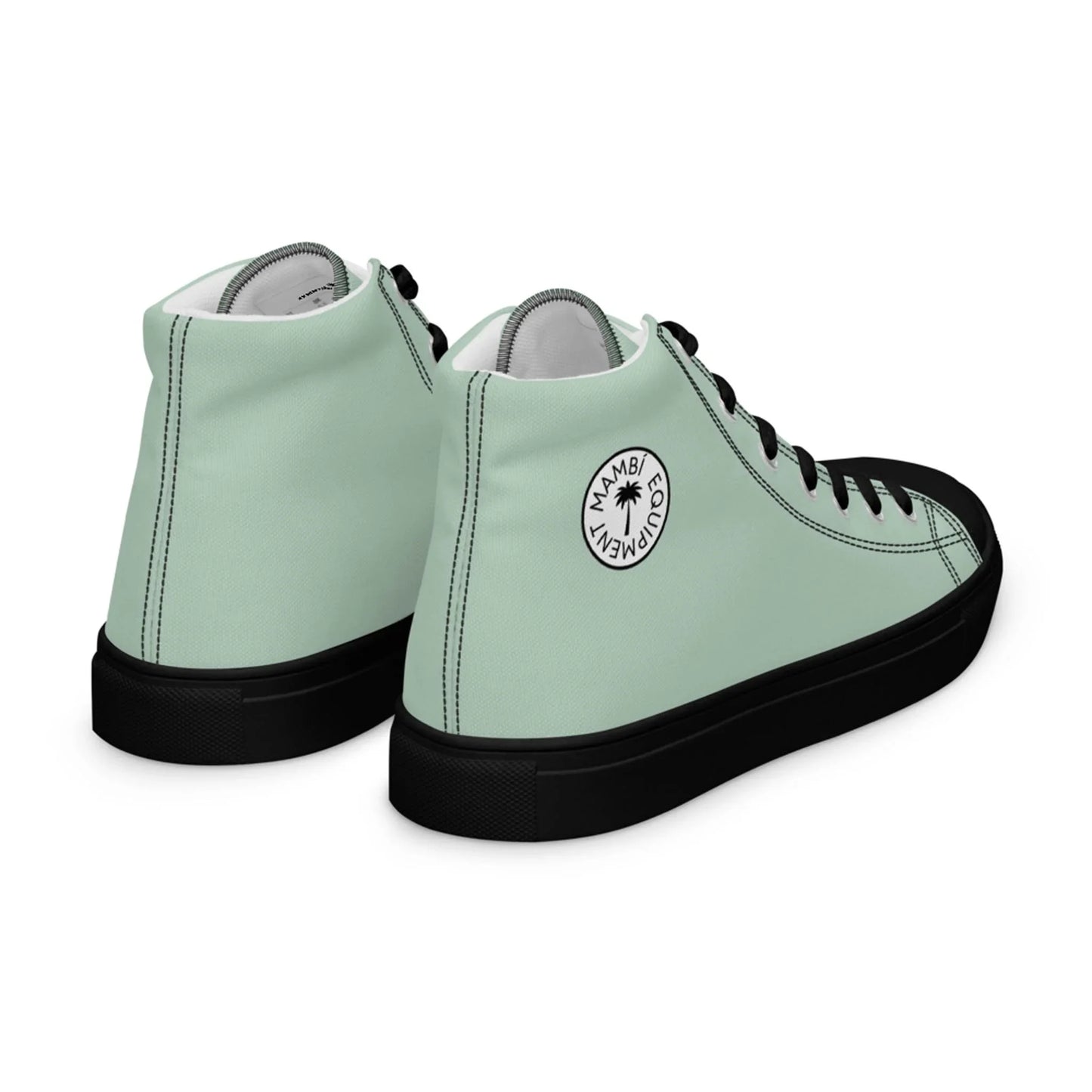 A pair of mint green high-top sneakers with black soles and black laces. A circular logo featuring a palm tree and the text MIAMI, CANVAS NEW, and Mambí decorates the outer side of each shoe.