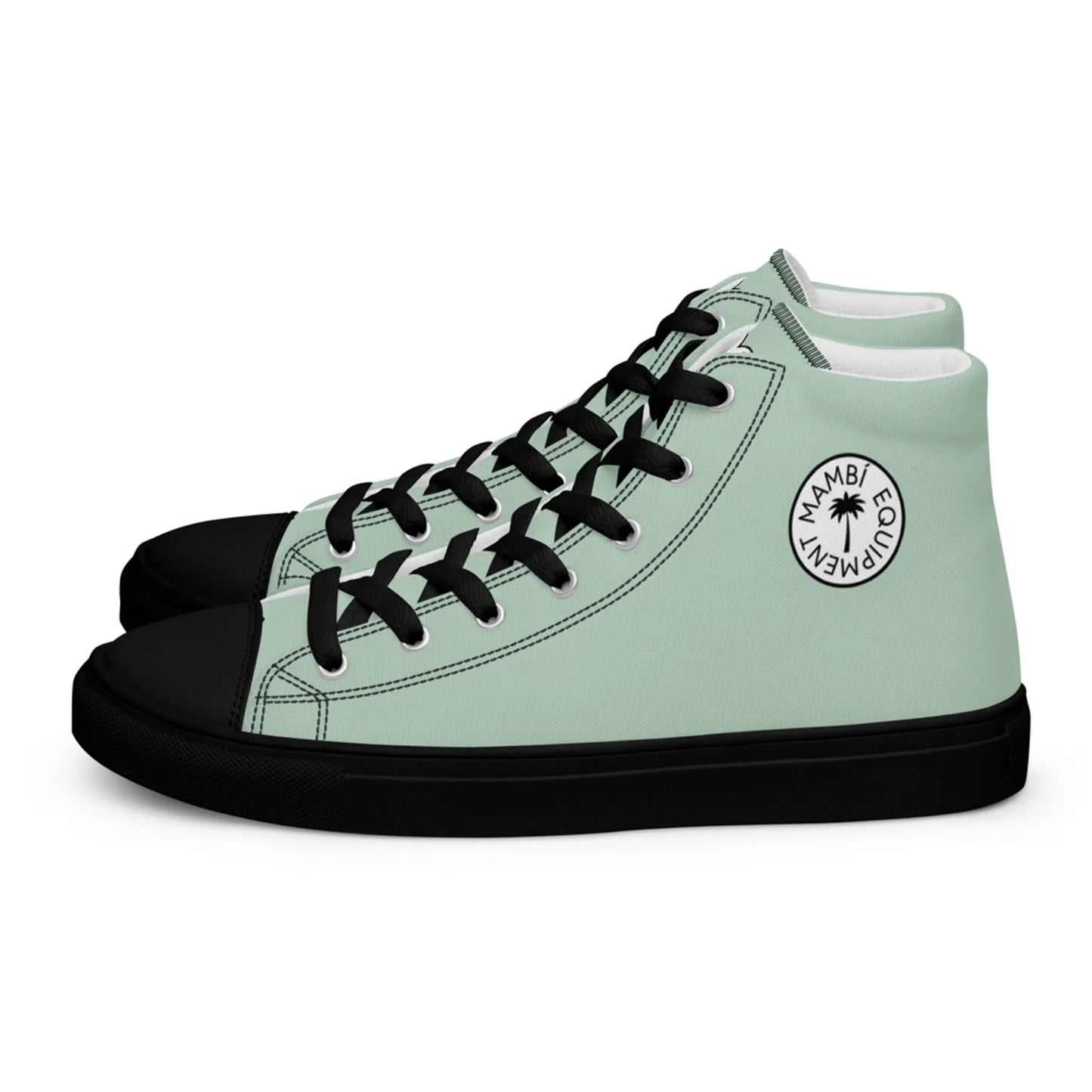 A pair of mint green high-top sneakers with black soles, toe caps, and laces. Each shoe features a circular white Mambí logo with a palm tree and the words MAMBI ECUMEN on the outer side.