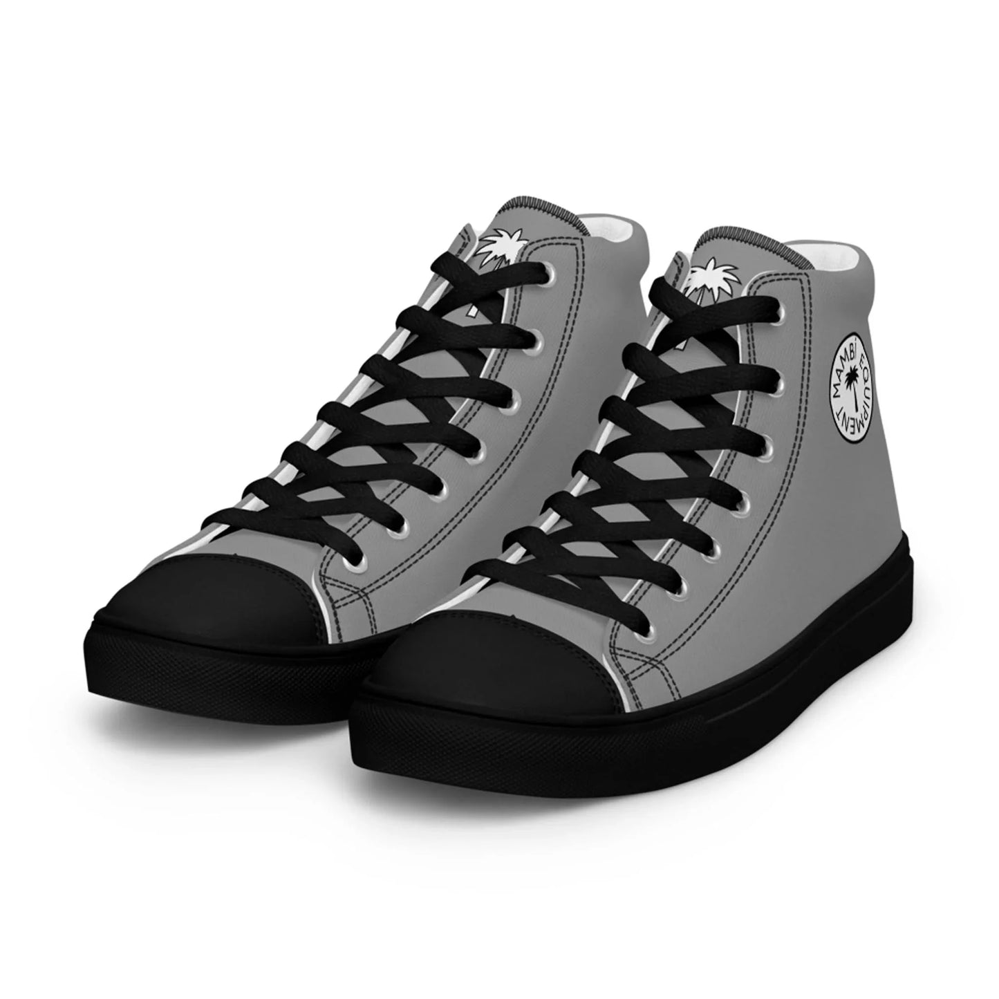 A pair of gray high-top sneakers with black laces, soles, and toe caps. Each shoe features a round Mambí logo with palm tree graphics on the outer ankle area.
