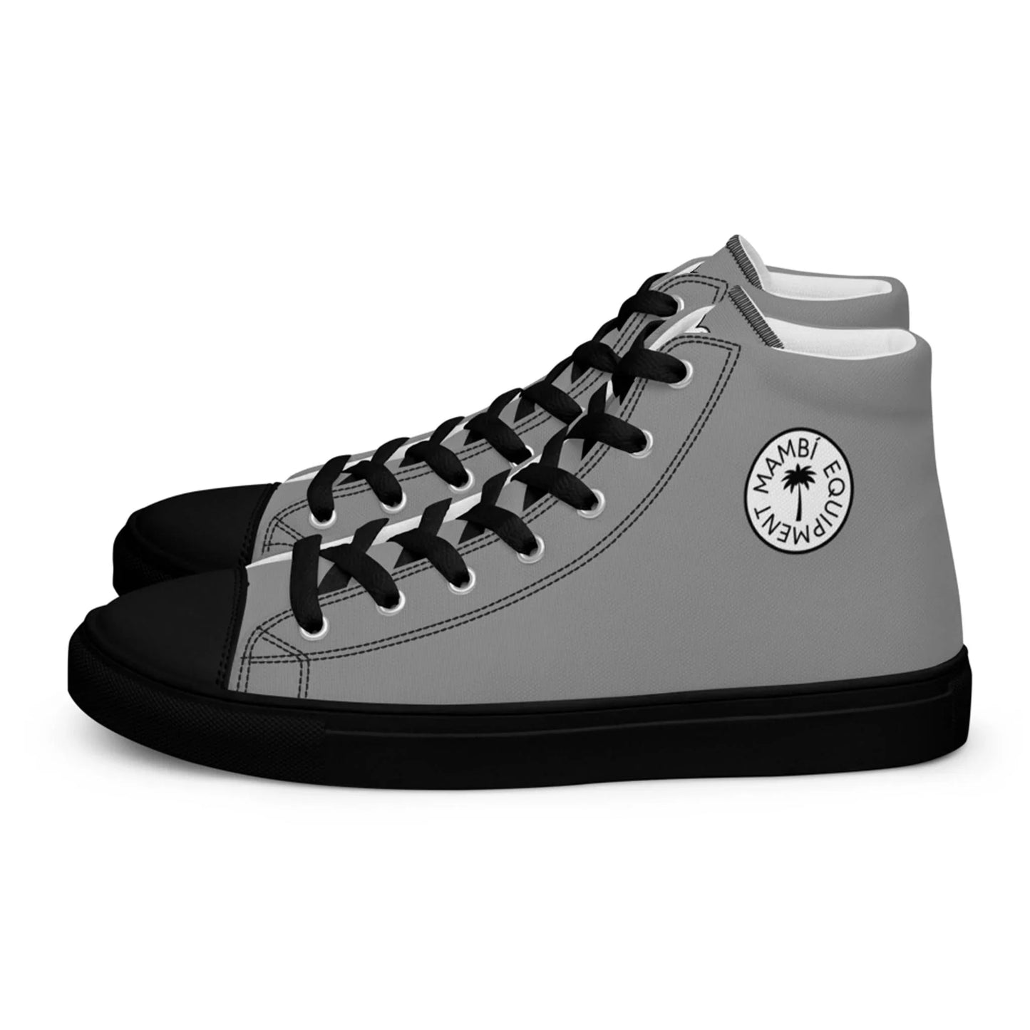 A pair of high-top Mambí sneakers with gray uppers, black laces, black toe caps, and black soles. The outer sides feature a circular white logo with the text MAMBI EQUALITY and a small palm tree.
