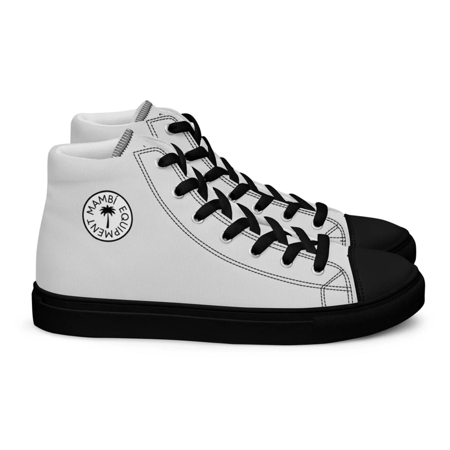 A pair of white high-top sneakers with black soles, black laces, and black toe caps. Each shoe’s side displays a circular Mambí logo featuring the words EQUIPMENT and MAMBI around a star shape.
