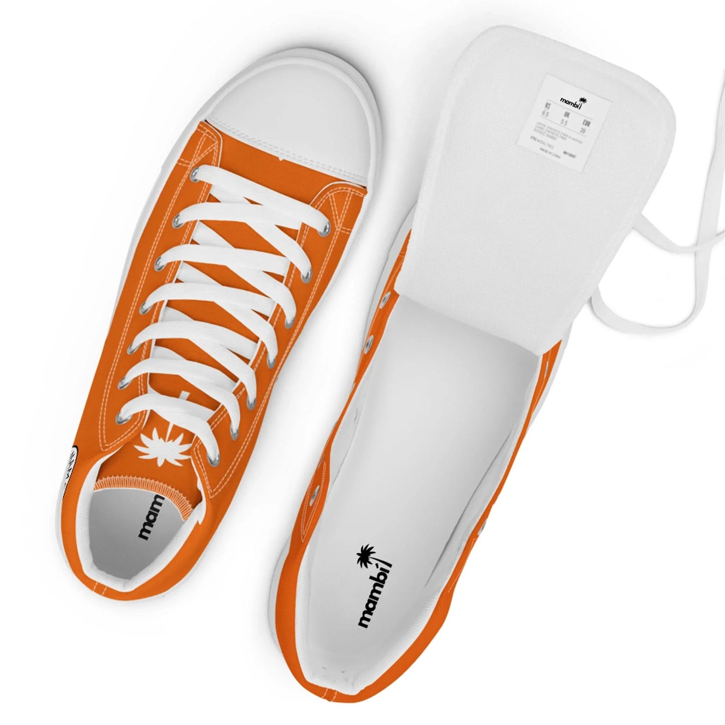 Two orange and white lace-up sneakers are shown from above. One shoe is fully laced, while the other is open with the tongue pulled out, displaying the inner label and Mambí palm tree branding on the insole.