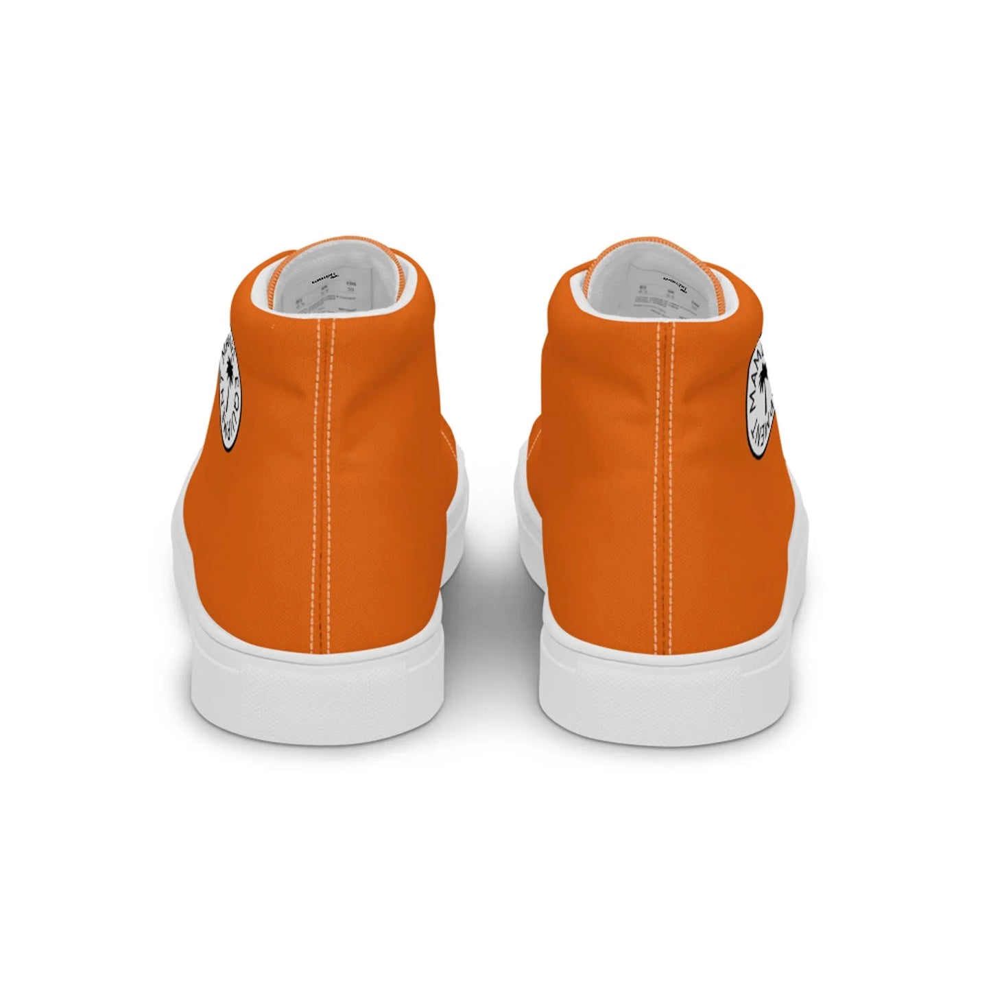 A pair of orange high-top Mambí sneakers with white soles, viewed from the back. Each shoe features a circular black and white logo near the heel.