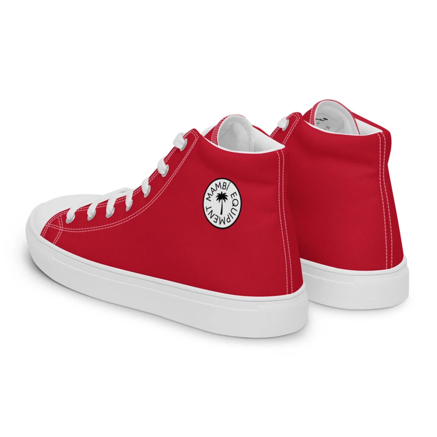 A pair of red high-top sneakers with white soles and laces. One shoe features a circular white logo patch on the ankle that reads Mambí Compadre with a small palm tree in the center.