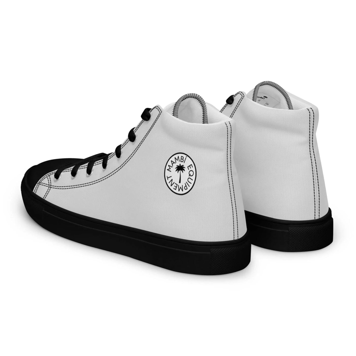 A pair of high-top sneakers with a white body, black laces, black toe caps, and black soles. The side features a circular black logo with the text HAMBUCUPDRIVEN, a star in the center, and subtle Mambí style details.