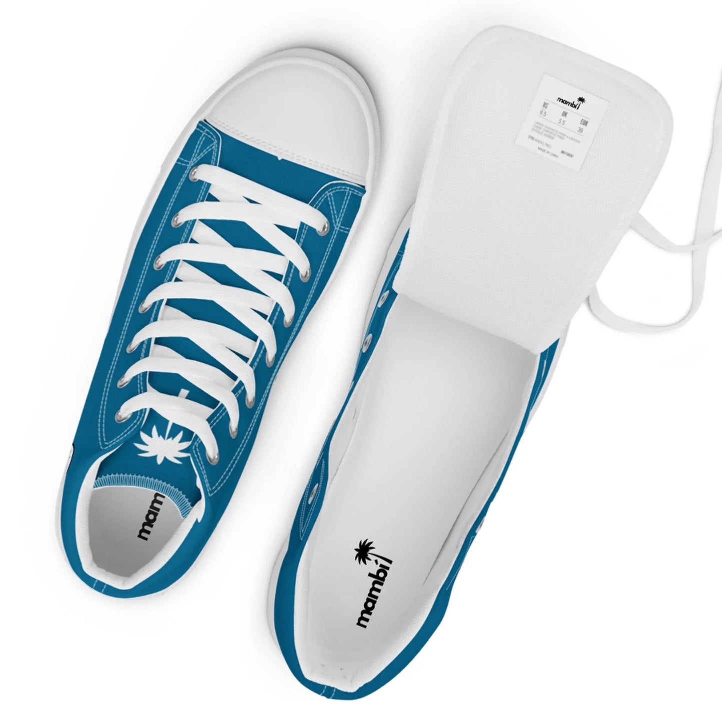 Top view of a pair of blue and white sneakers with white laces. One shoe displays the insoles and the Mambí logo with a palm tree, while the other has its tongue lifted, revealing a white label inside.