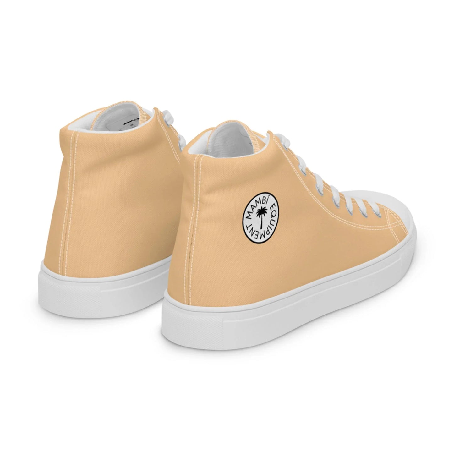 A pair of light peach high-top sneakers with white soles and laces. Each shoe features a circular black-and-white Mambí logo with a palm tree and the words MAMBI MOVEMENT on the outer side.
