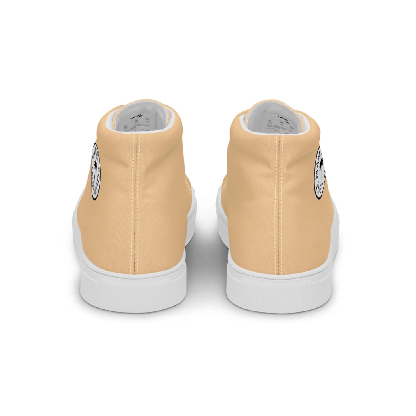 Back view of a pair of light beige Mambí high-top sneakers with white soles. A black and white circular graphic is visible on the outer side of each shoe near the heel.
