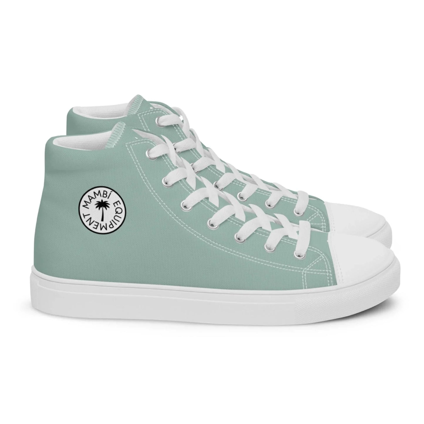 A pair of mint green high-top sneakers with white laces, white toe caps, and rubber soles. A circular black-and-white Mambí ECO MOVEMENT logo is visible on the side.