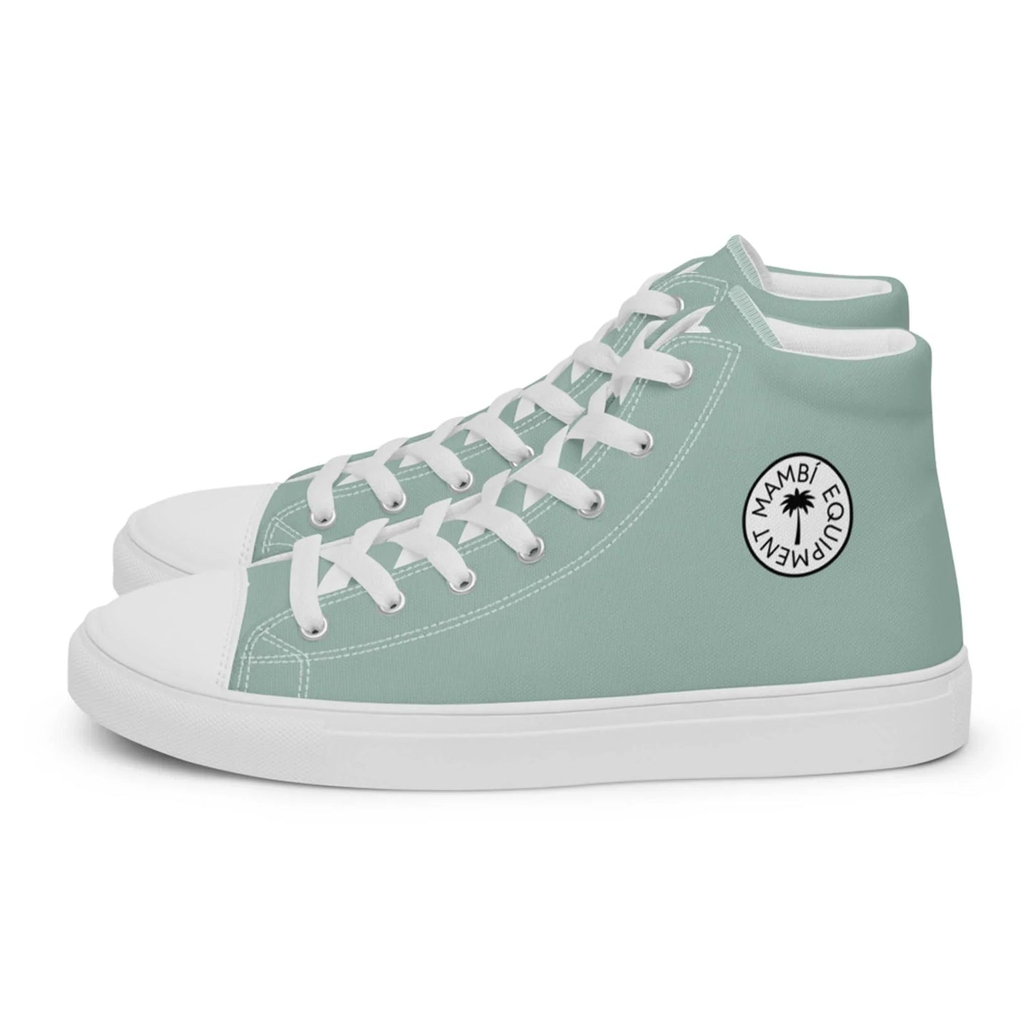 A pair of light green high-top sneakers with white laces, toe caps, and soles. The outer side features a circular black-and-white Mambí EQUIPMENT logo with a small palm tree graphic.