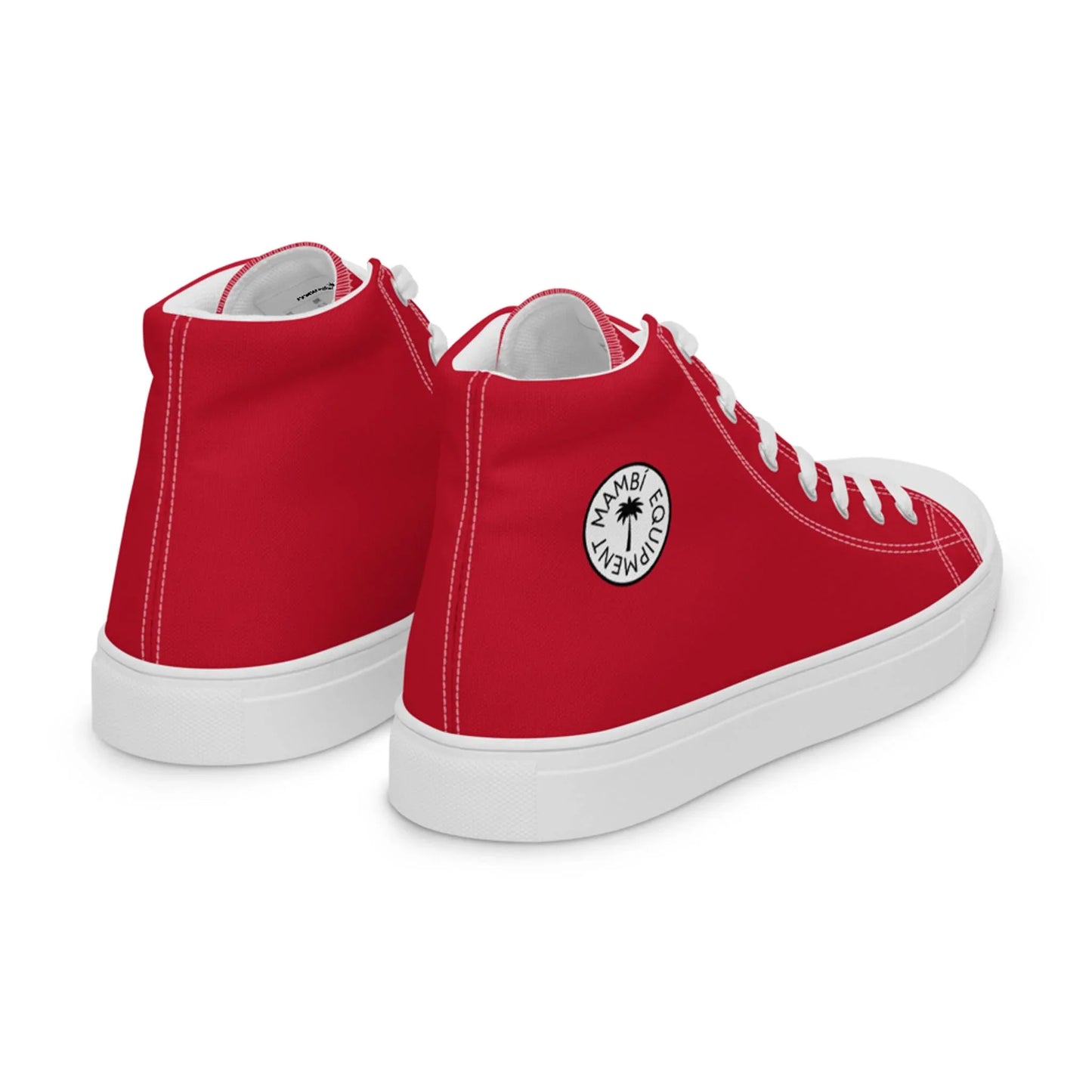 A pair of red high-top sneakers with white soles and laces. Each shoe features a circular white logo with black text, a small palm tree graphic, and the word Mambí on the outer side near the ankle.