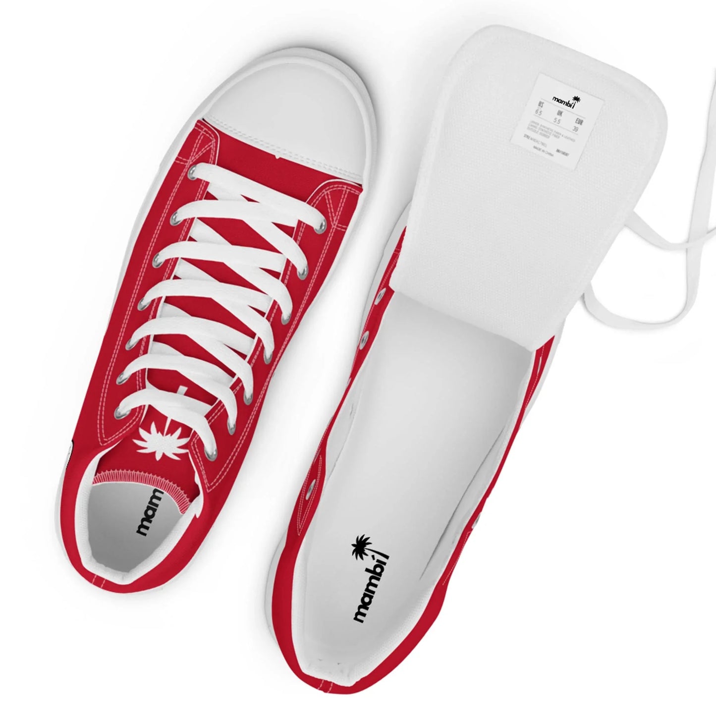 Top view of red and white lace-up Mambí sneakers with white soles. One shoe is upright and the other on its side with the tongue lifted, revealing the label and inner branding featuring a palm tree logo.