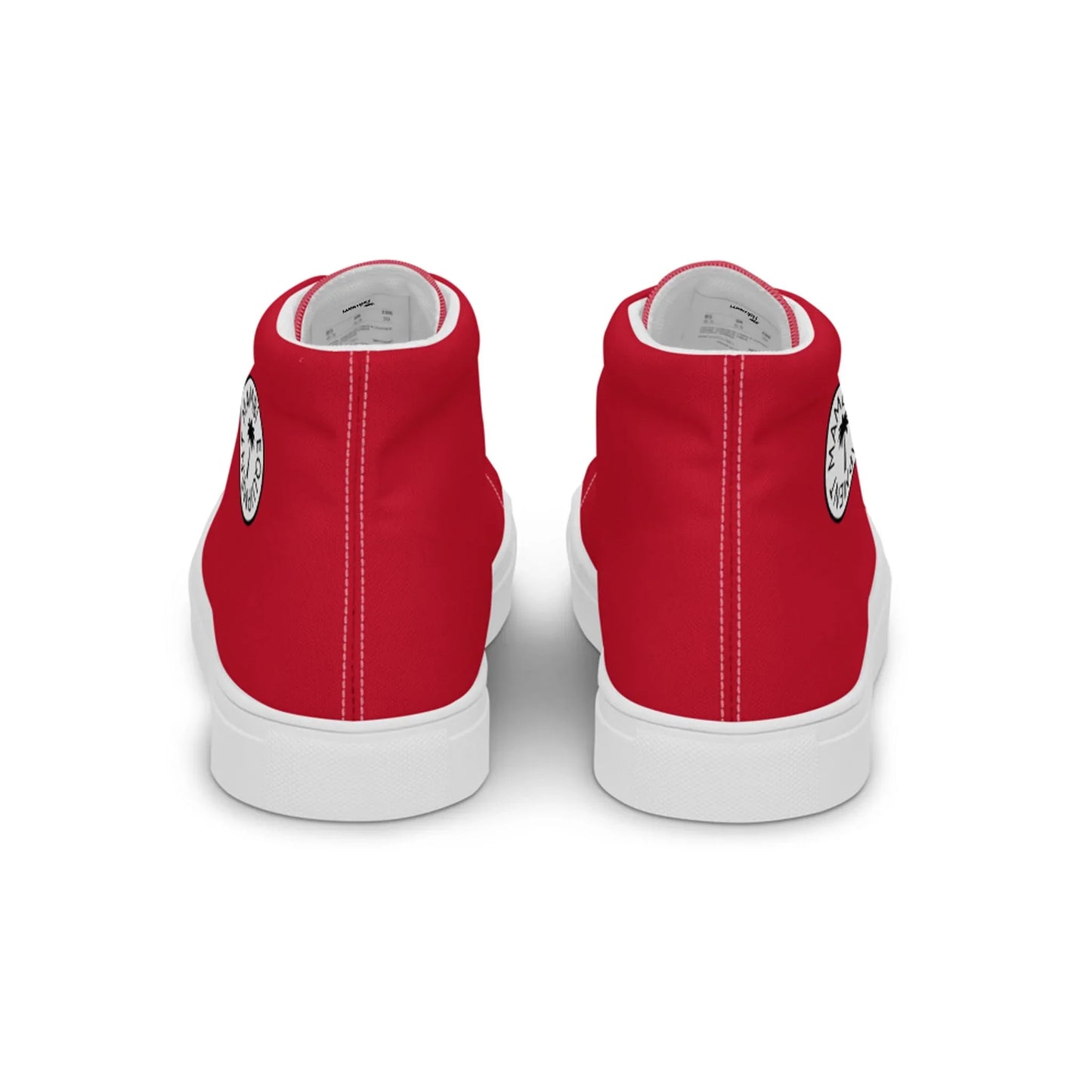 A pair of red Mambí high-top sneakers with white soles, shown from the back. Each shoe features a small black-and-white circular graphic on the heel.