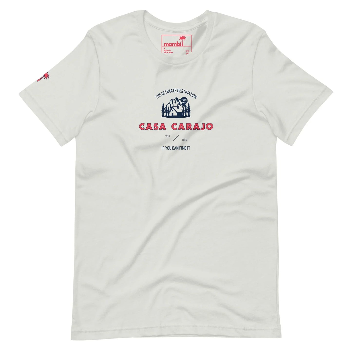 White t-shirt with a graphic featuring a small illustrated house, the text The Ultimate Destination, Casa Carajo, and a nod to Mambí spirit. Small red palm tree on the left sleeve.