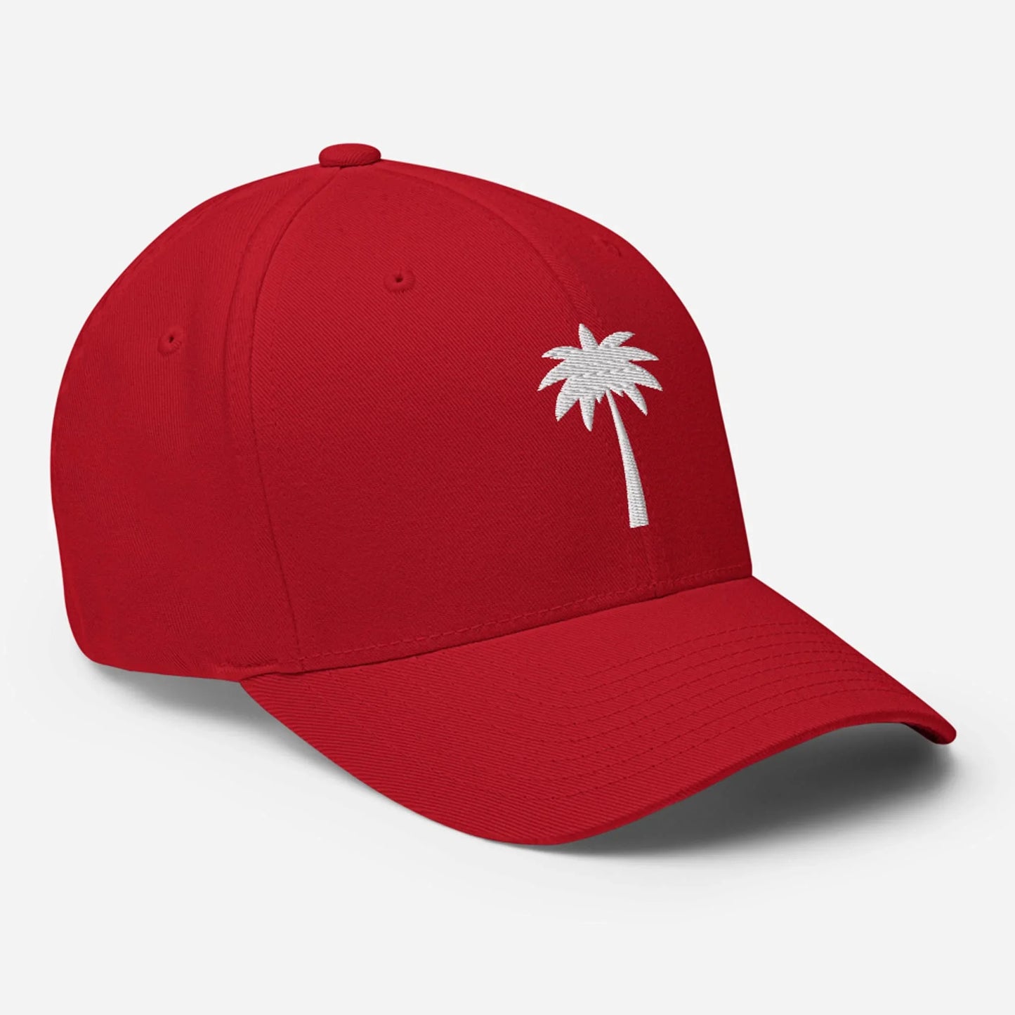 A bright red Mambí baseball cap featuring a simple white palm tree design embroidered on the front, shown against a plain white background.