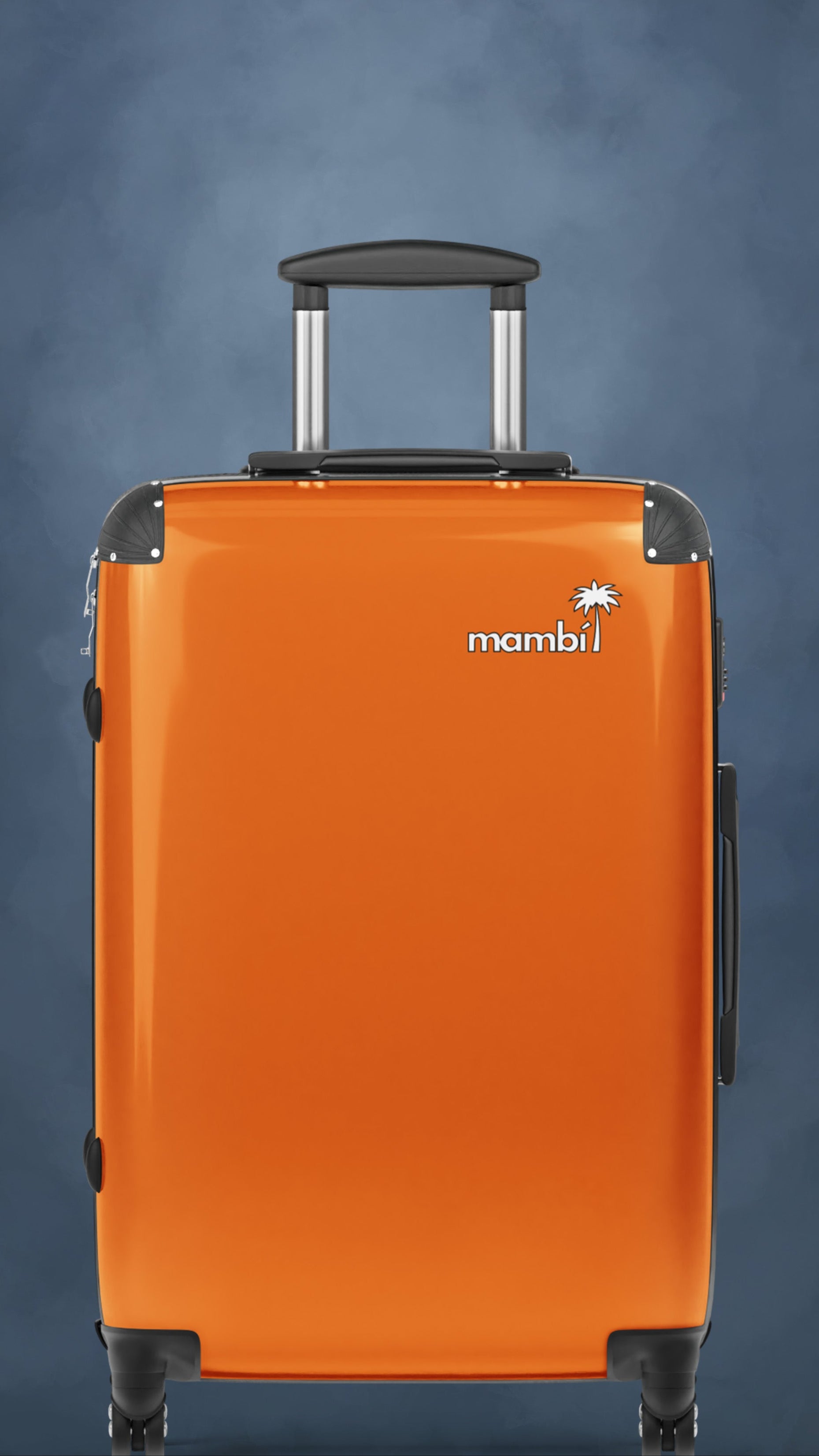 A bright orange hard-shell suitcase with a black handle and silver accents, standing upright on a blue textured background. The suitcase features the logo mambi with a small palm tree above the lettering.