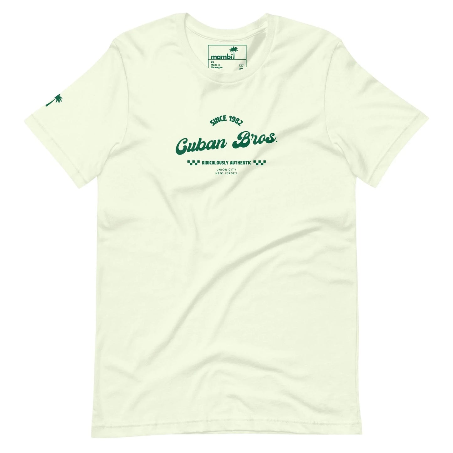 Printfuls Cuban Bros Graphic Tee | Unisex: Off-white with vintage green text—Since 1992, Cuban Bros, Brooklyn’s Authentic NYC—and a palm tree sleeve detail. Part of the Neighborhood Collection. Tag inside collar reads momini. Relaxed, entrepreneurial style.