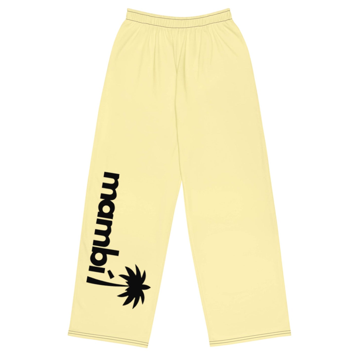 Light yellow pants with an elastic waistband. The left leg showcases mambí in bold black lowercase letters, vertically aligned beside a black palm tree graphic near the ankle.