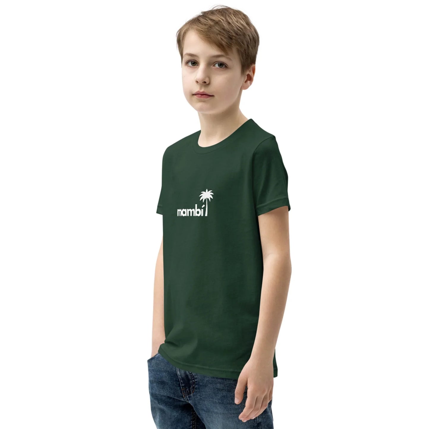 A young boy with short, light brown hair stands with one hand in his pocket, wearing a dark green t-shirt that features the word Mambí and a small palm tree graphic printed in white on the front.
