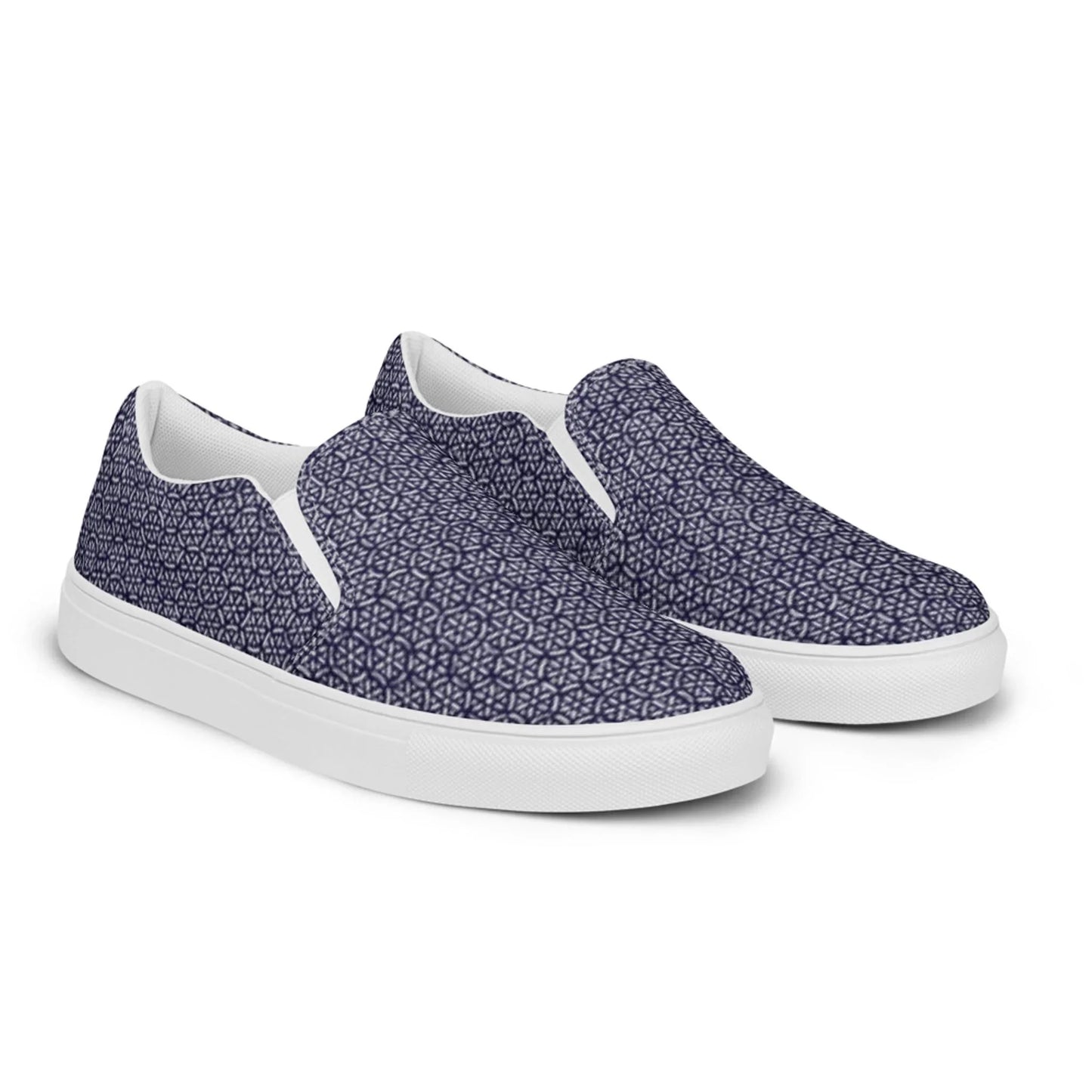 The Digno Handmade Slip-On Canvas Shoes for men by Printful feature a white sole and navy blue upper with a geometric star pattern—perfect for making a stylish statement.