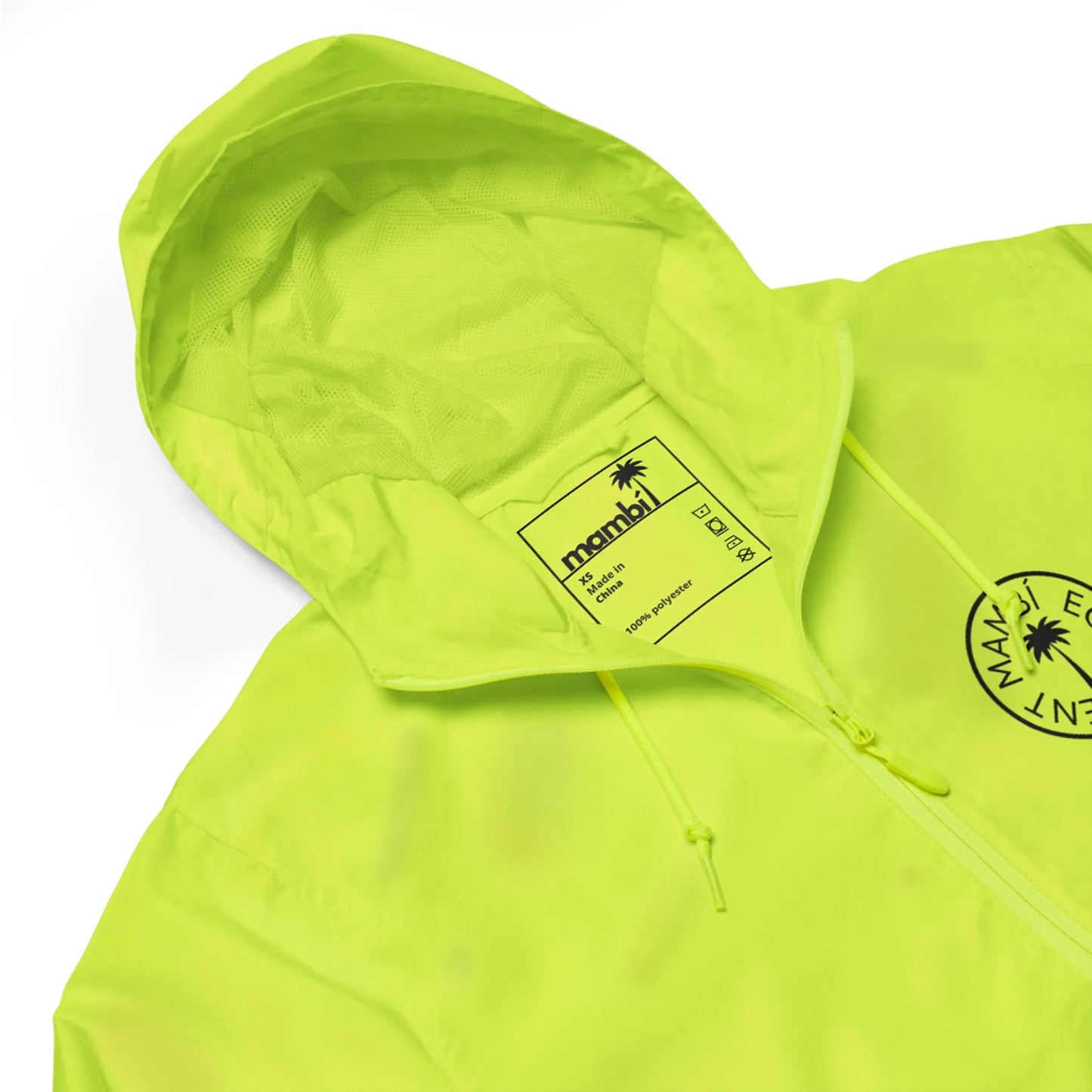 A neon yellow hooded jacket with a drawstring, featuring a logo and label inside the collar that reads Mambí. The jacket also displays a circular black emblem on the front.