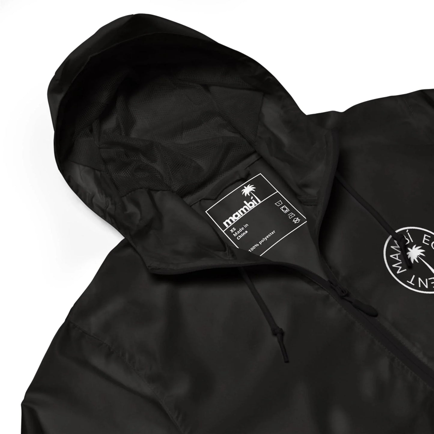 A black hooded jacket with a drawstring, featuring a circular white Maui Element logo on the chest, a visible inner label with product details, and Mambí-inspired style.