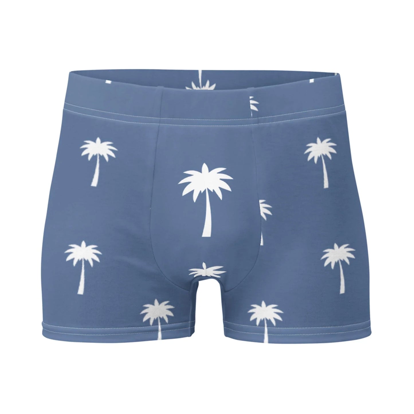 The Emerson Boxer Brief by Printful features a blue design with white palm tree patterns and a no-back-seam construction for a smooth, seamless fit, shown against a white background.