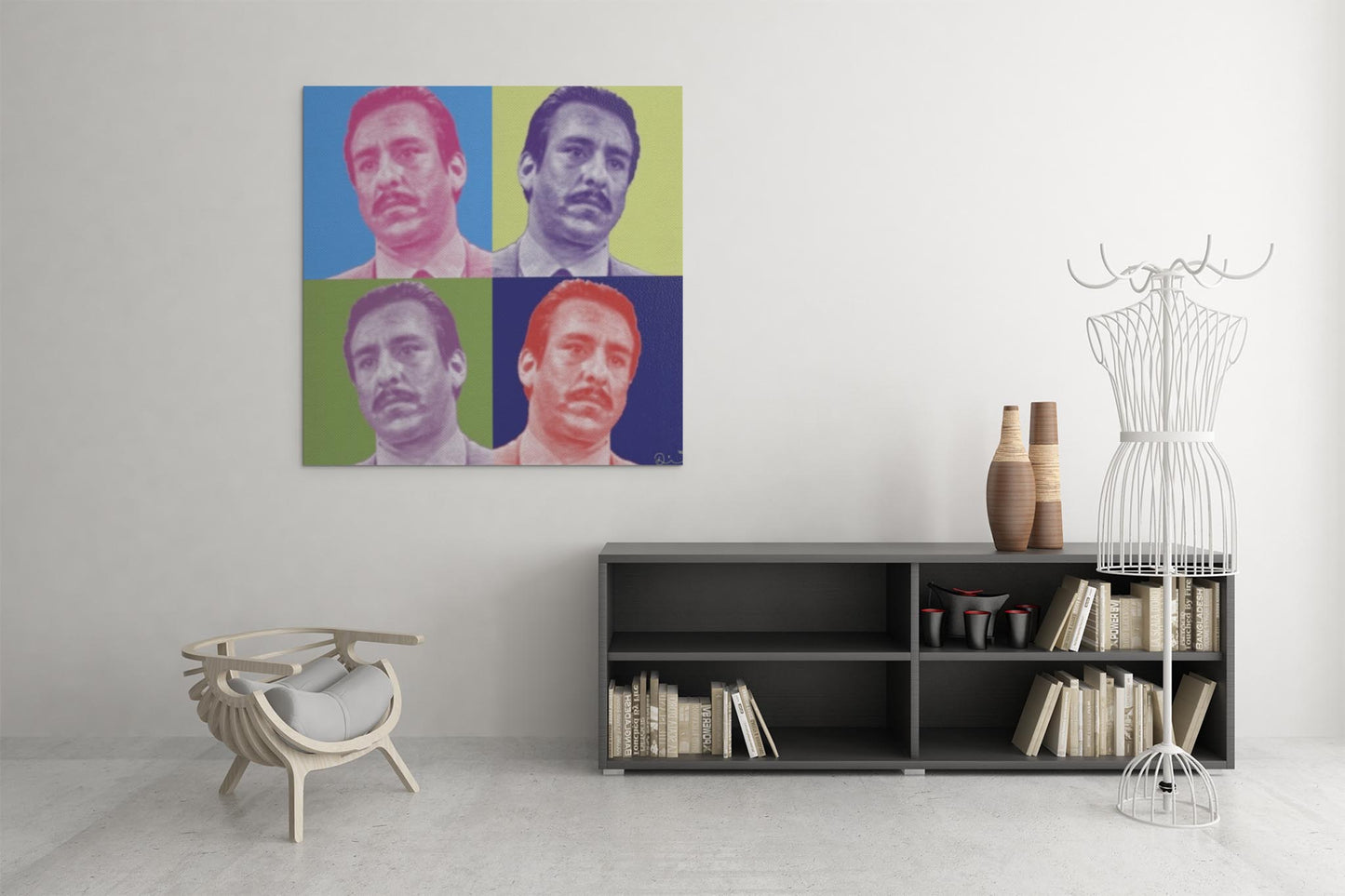 Minimalist living room featuring a modern chair, low bookshelf with books and vases, a wireframe mannequin, and a Mambí-inspired pop art portrait of a man in four color variations hanging on the wall.