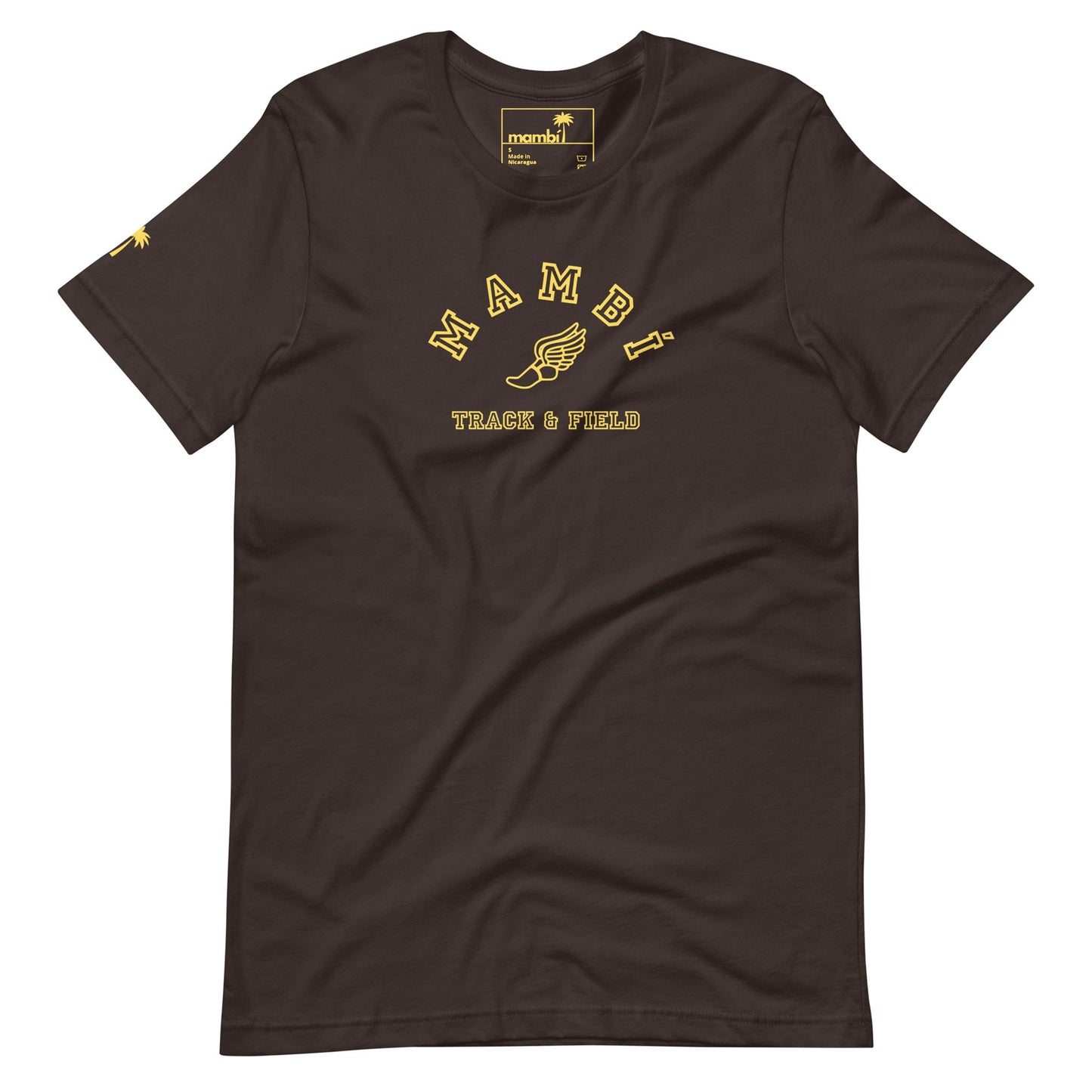 A brown Mambí T-shirt featuring yellow text that reads MAMBI above a winged shoe graphic and TRACK & FIELD below, with a yellow logo on the inner collar and a small yellow graphic on the left sleeve.