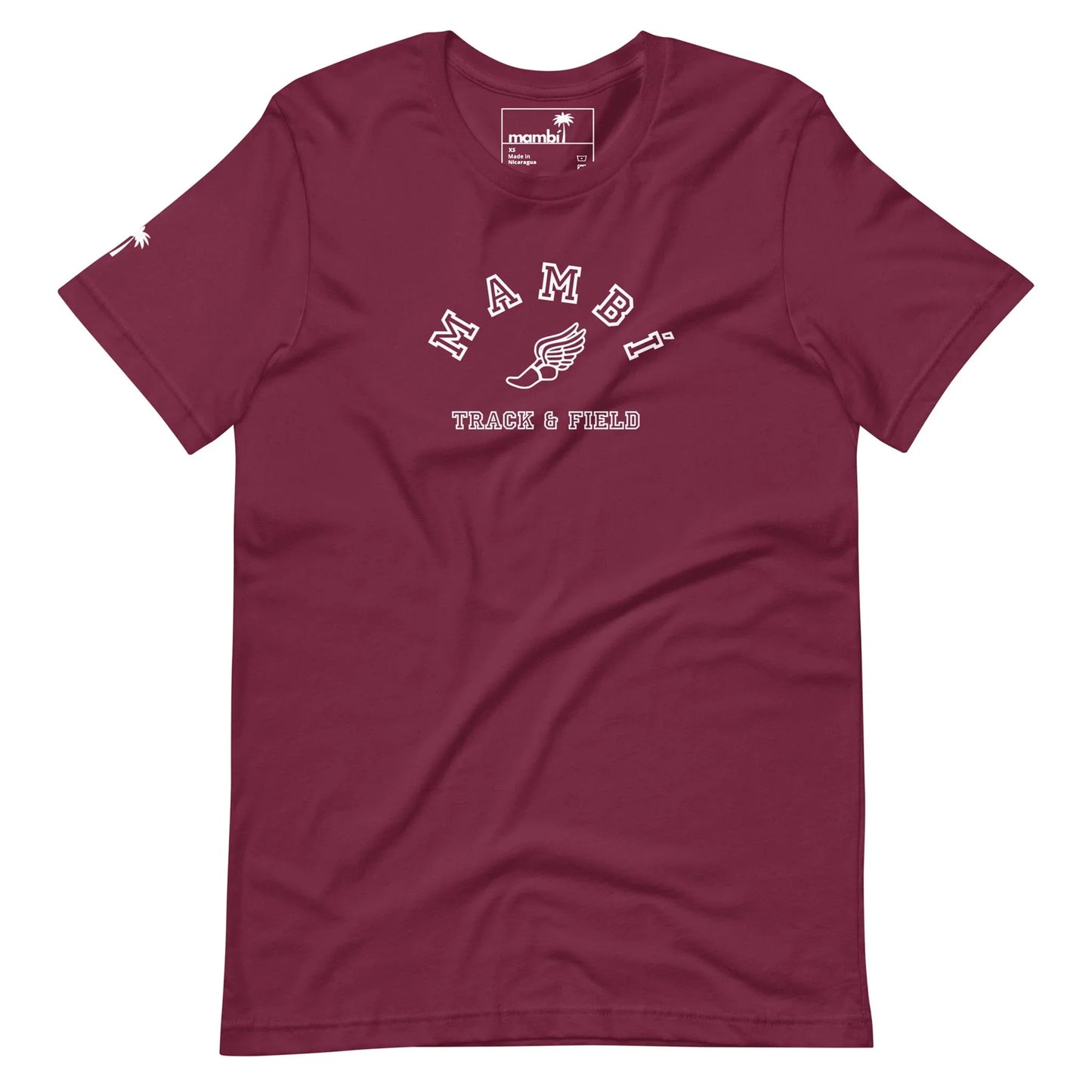 A maroon t-shirt featuring MAMBA and TRACK & FIELD in white lettering, a winged shoe graphic beneath, and a subtle Mambí touch for added style.