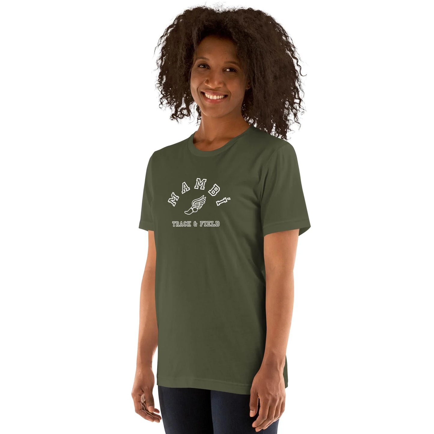Smiling person with curly hair wears an olive green Mambí Track & Field T-shirt featuring an illustrated winged shoe graphic, standing against a plain white background.