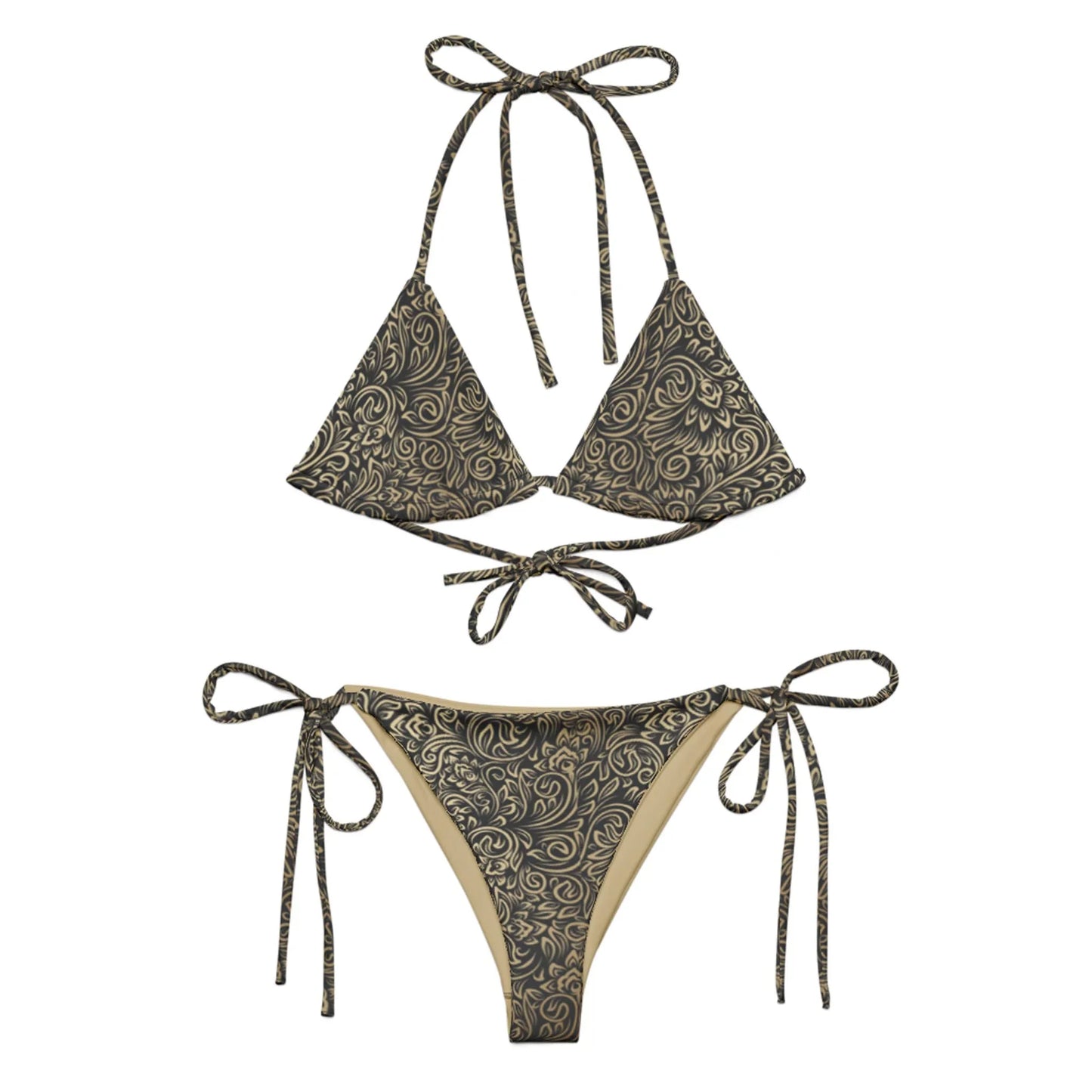 The Flavia String Bikini Swimsuit by Printful features a black and gold swirling floral pattern, triangle cups with ties, side-tie bottoms, recycled polyester fabric, and UPF 50+ sun protection.