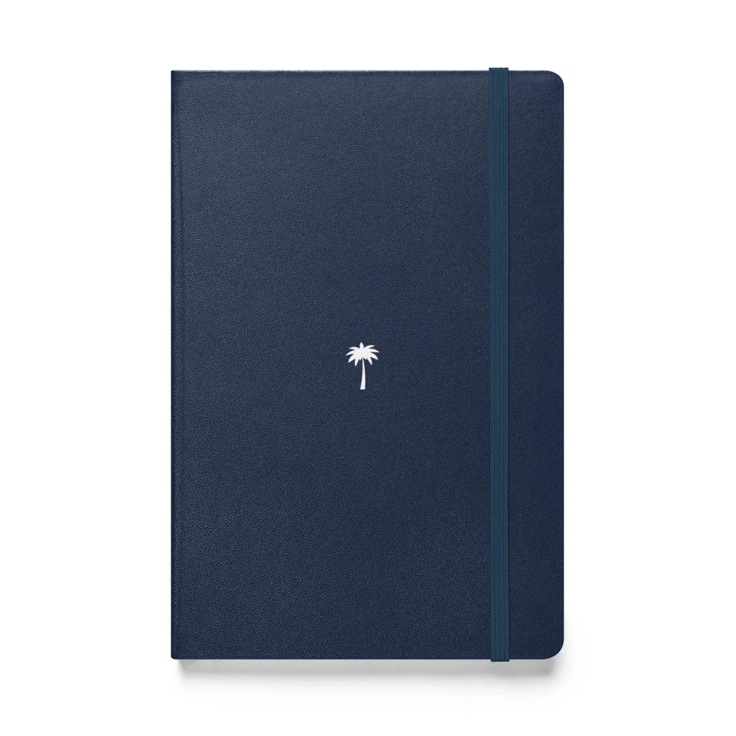 A closed, navy blue Mambí notebook with a small white palm tree design centered on the cover and an elastic band running vertically along the right edge.