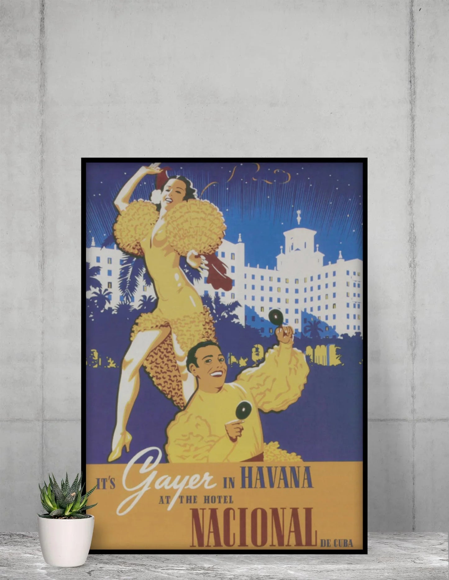 The Hotel Nacional Reprinted Vintage Poster by Printful (24x36, premium luster paper) features two dancers in yellow with maracas, the hotel’s white building aglow behind them, and a festive scene full of Cuban elegance.