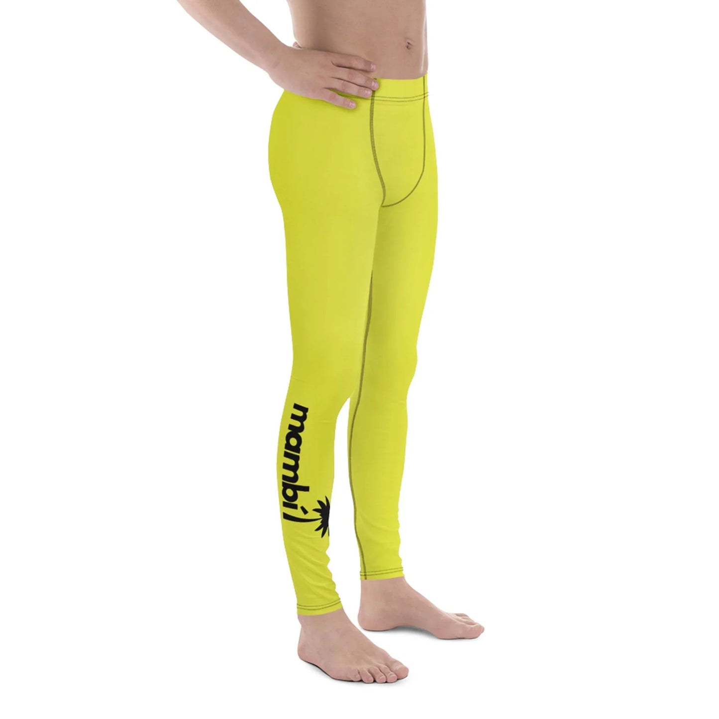 A person stands barefoot in bright yellow leggings with the word Mambí and a palm tree graphic in black on the lower left leg, set against a plain white background.