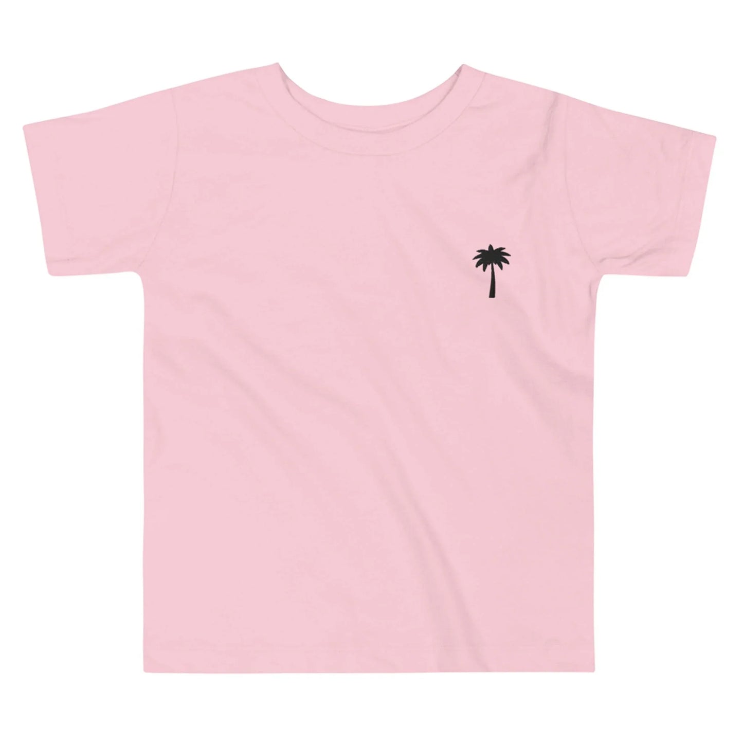Light pink Mambí t-shirt featuring a small, simple black palm tree graphic on the left chest area. Shirt is laid flat on a white background.